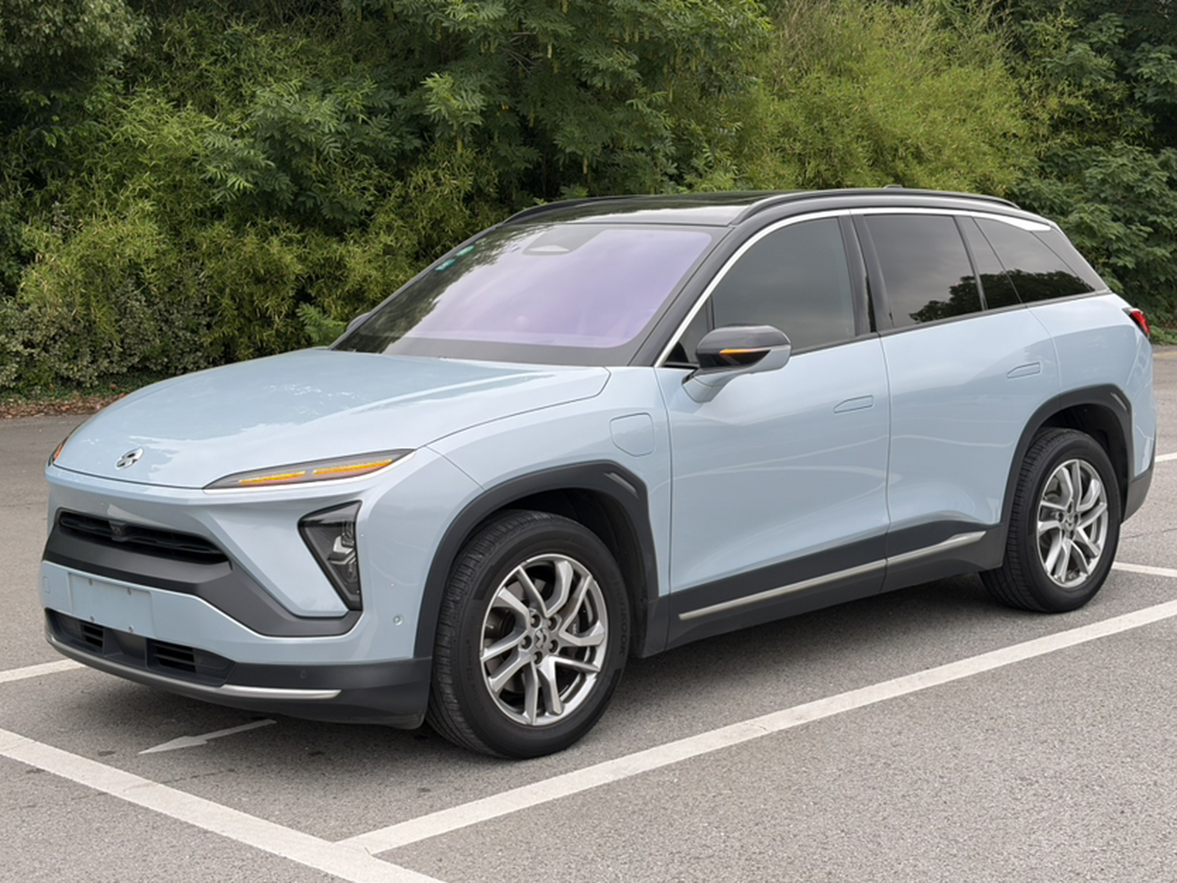 Under the front of the car