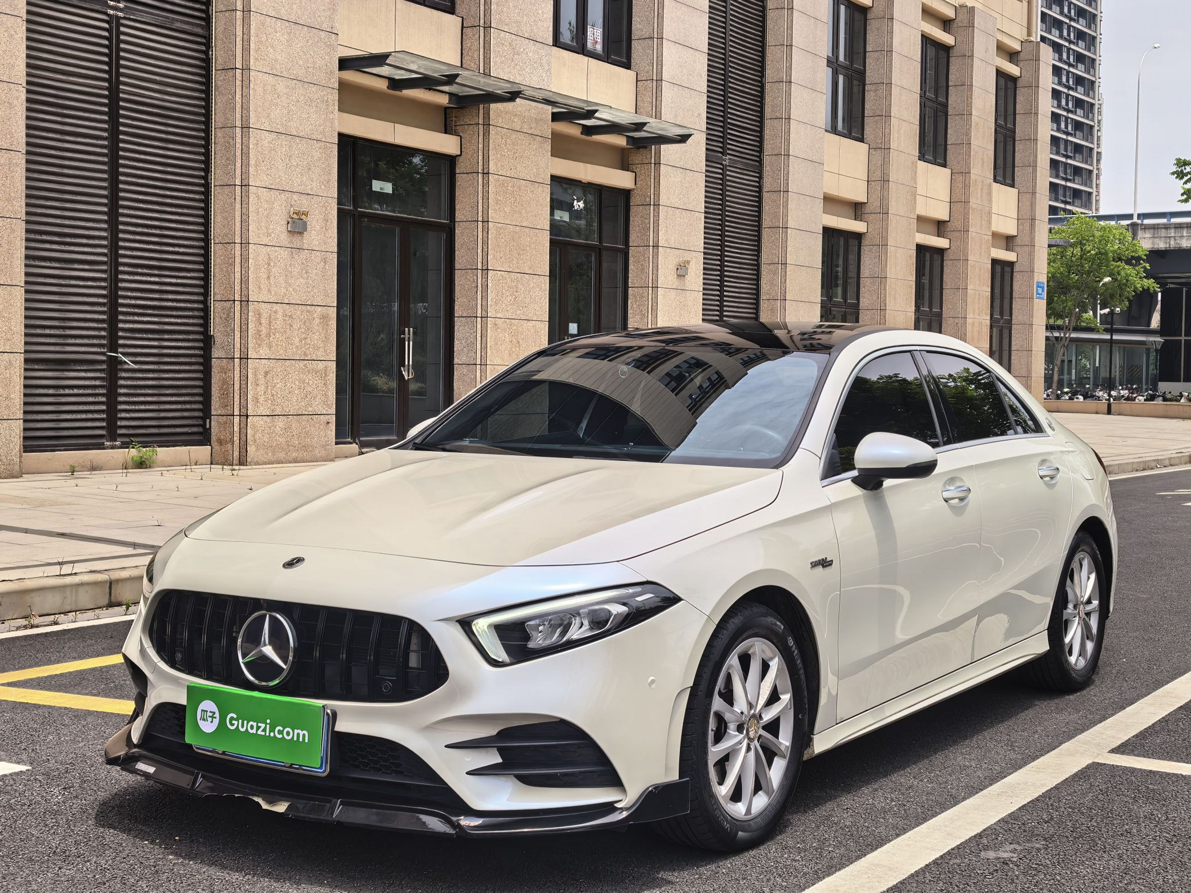 Under the front of the car