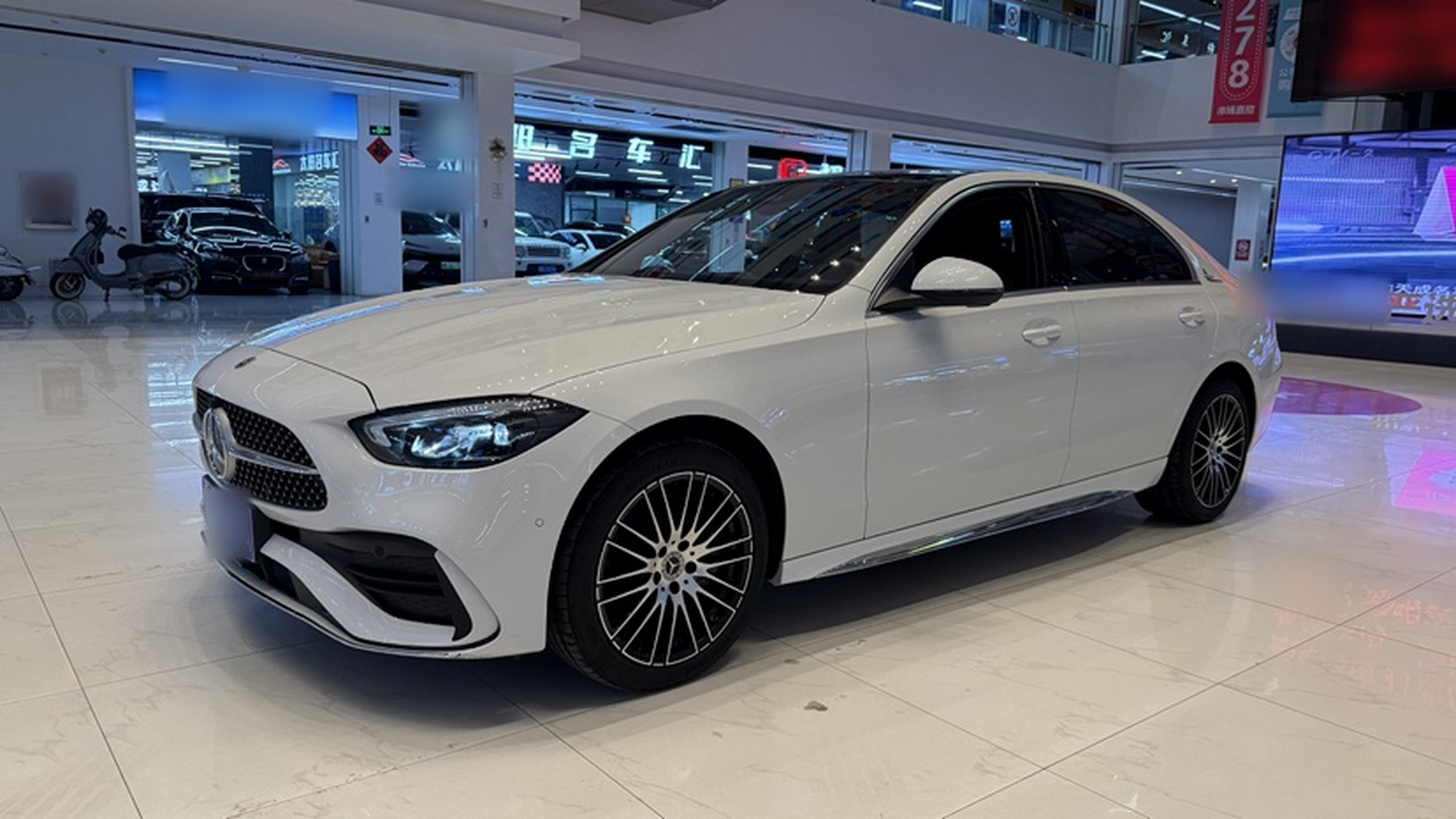 Under the front of the car