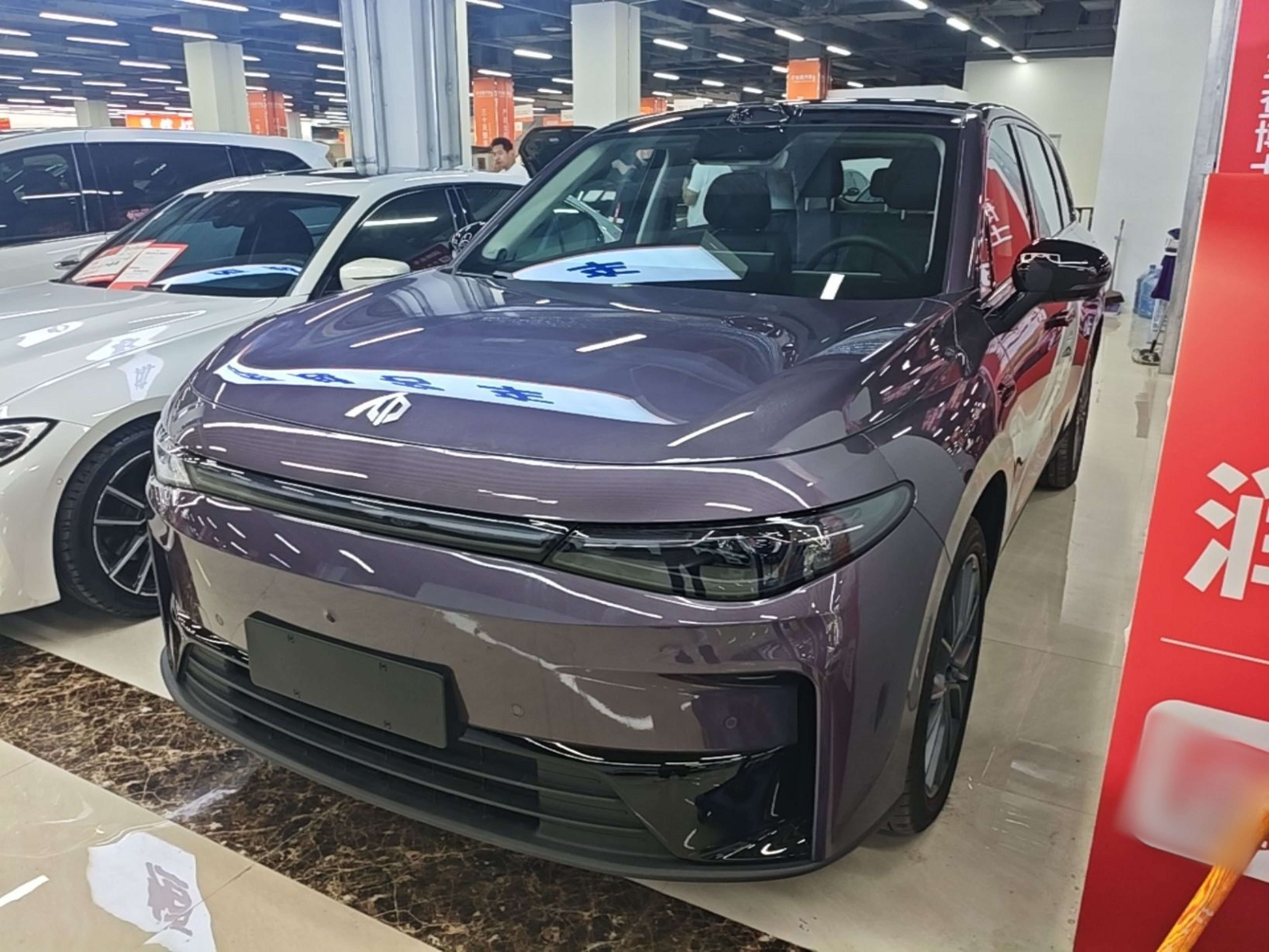 Under the front of the car