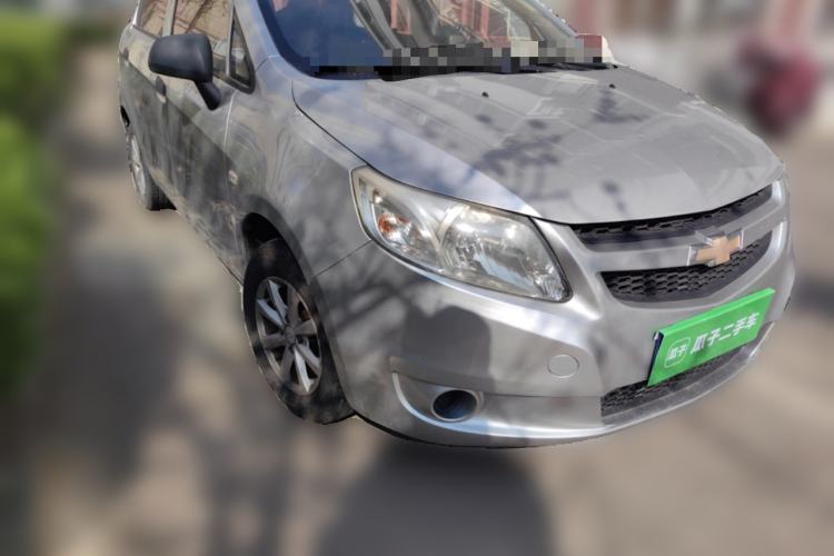 Used Chevrolet Sail 2013 Sedan 1.2L Manual Fashionable Happiness Edition Front Right 45 Deg