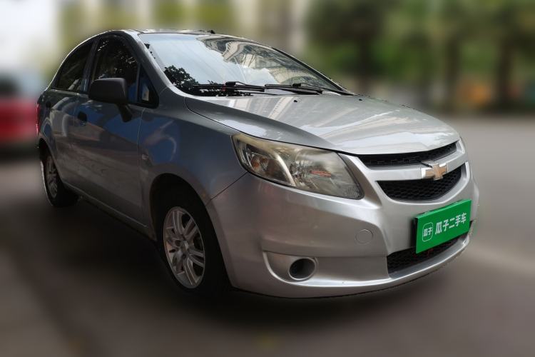 Used Chevrolet Sail 2013 Sedan 1.4L Manual Ideal Happiness Edition Front Right 45 Deg