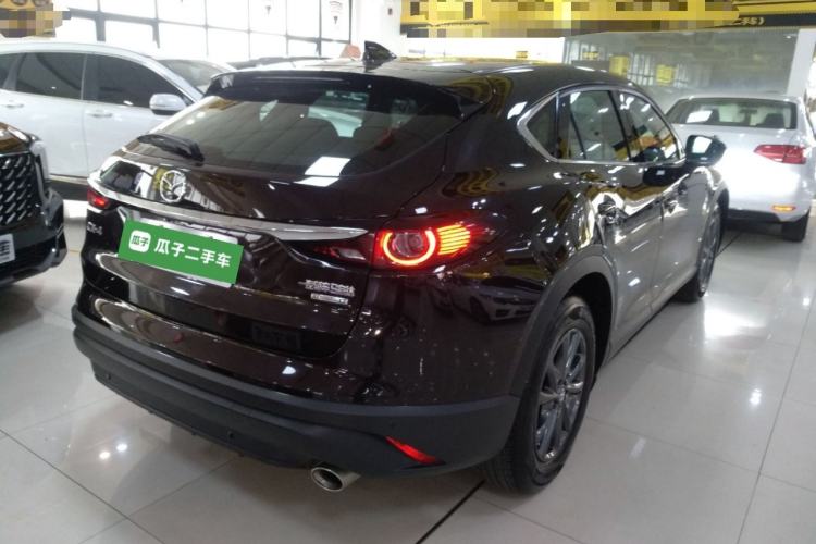 Used Mazda CX-4 2021 2.0L Automatic Two-Wheel Drive Blue Sky Dynamic Edition Rear Right 45 Deg