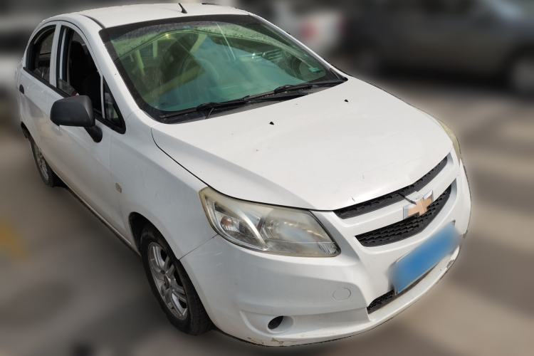 Used Chevrolet Sail 2013 Sedan 1.4L Manual Ideal Happiness Edition Front Right 45 Deg