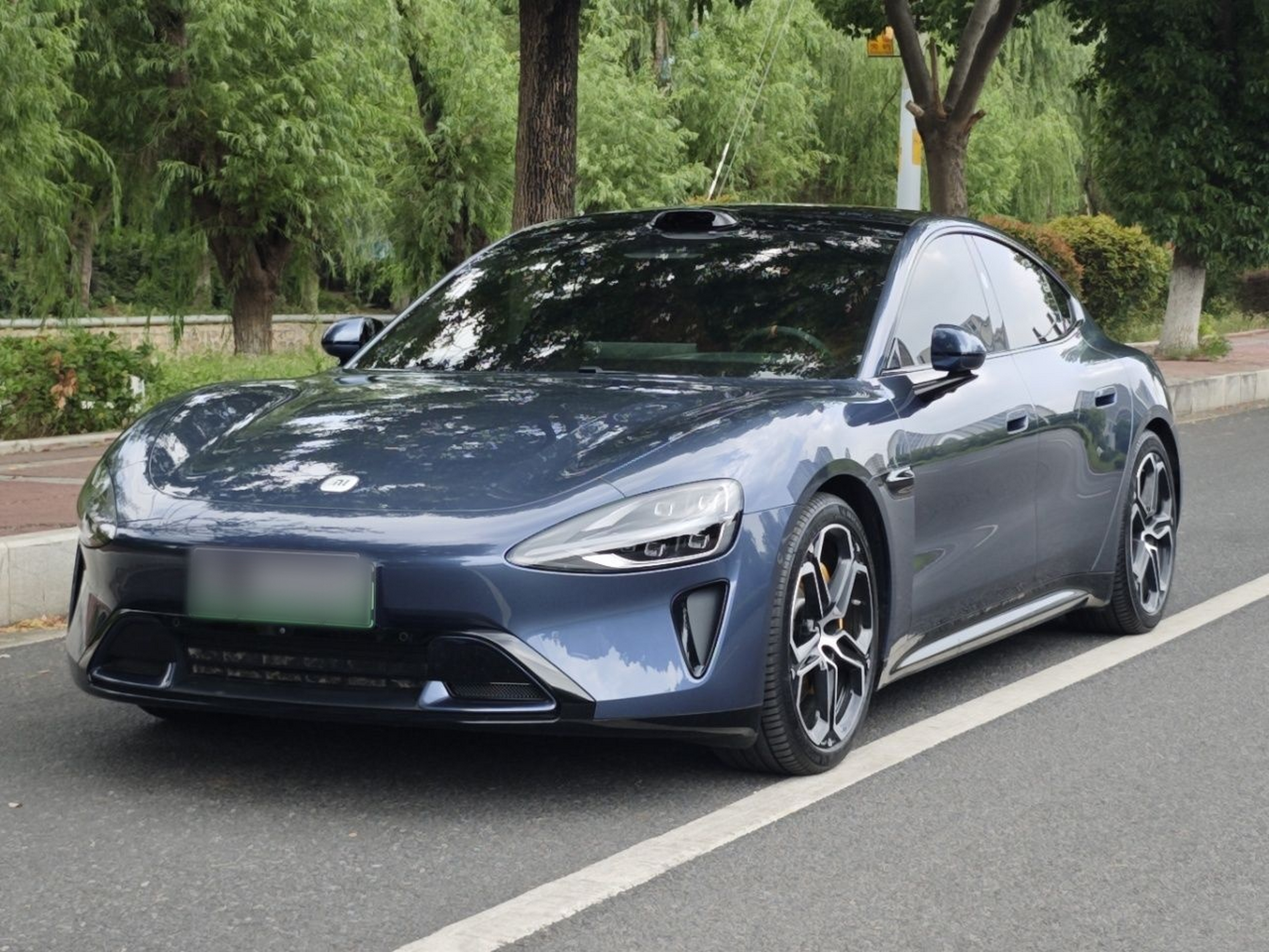 Under the front of the car