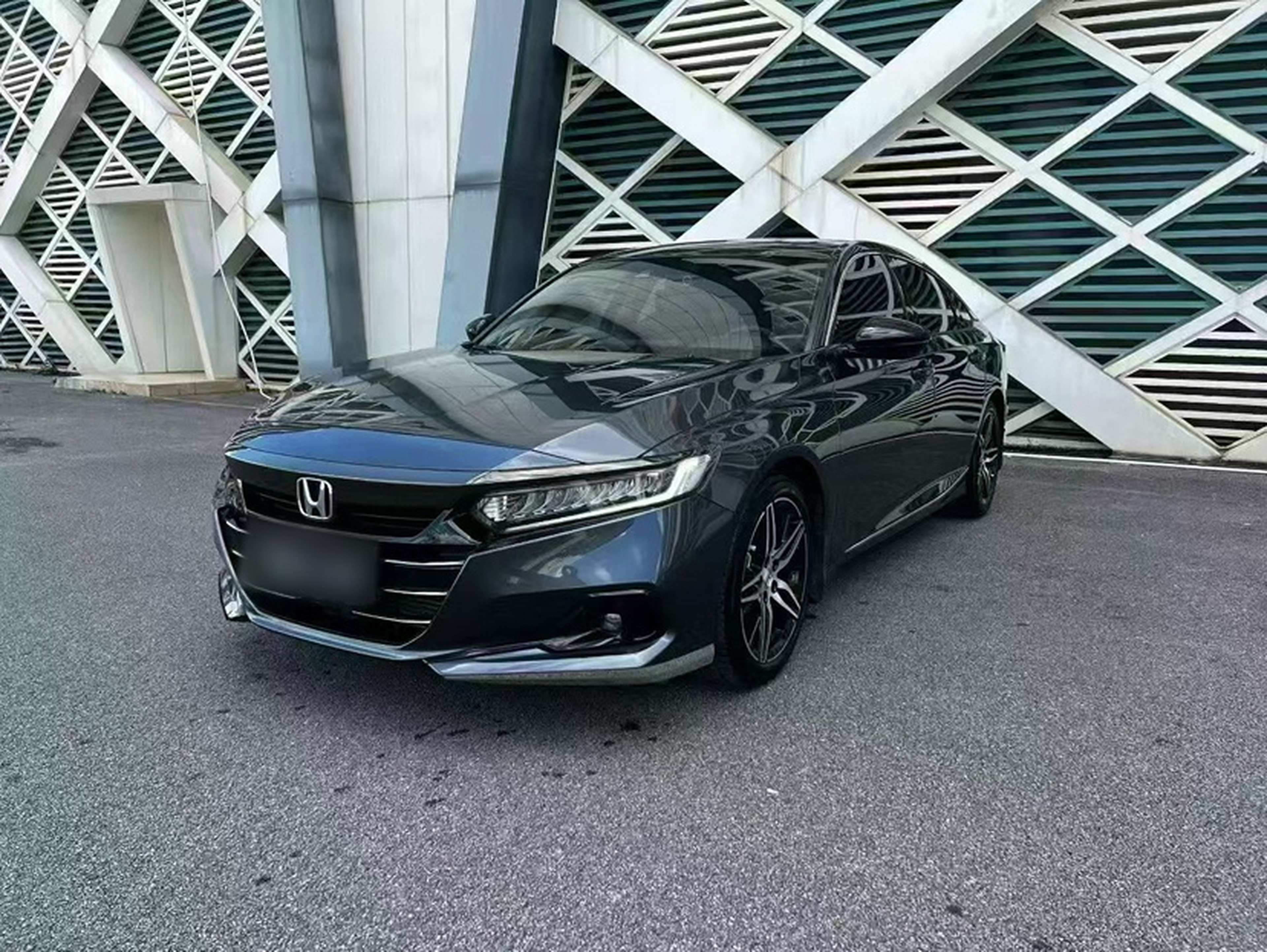 Under the front of the car