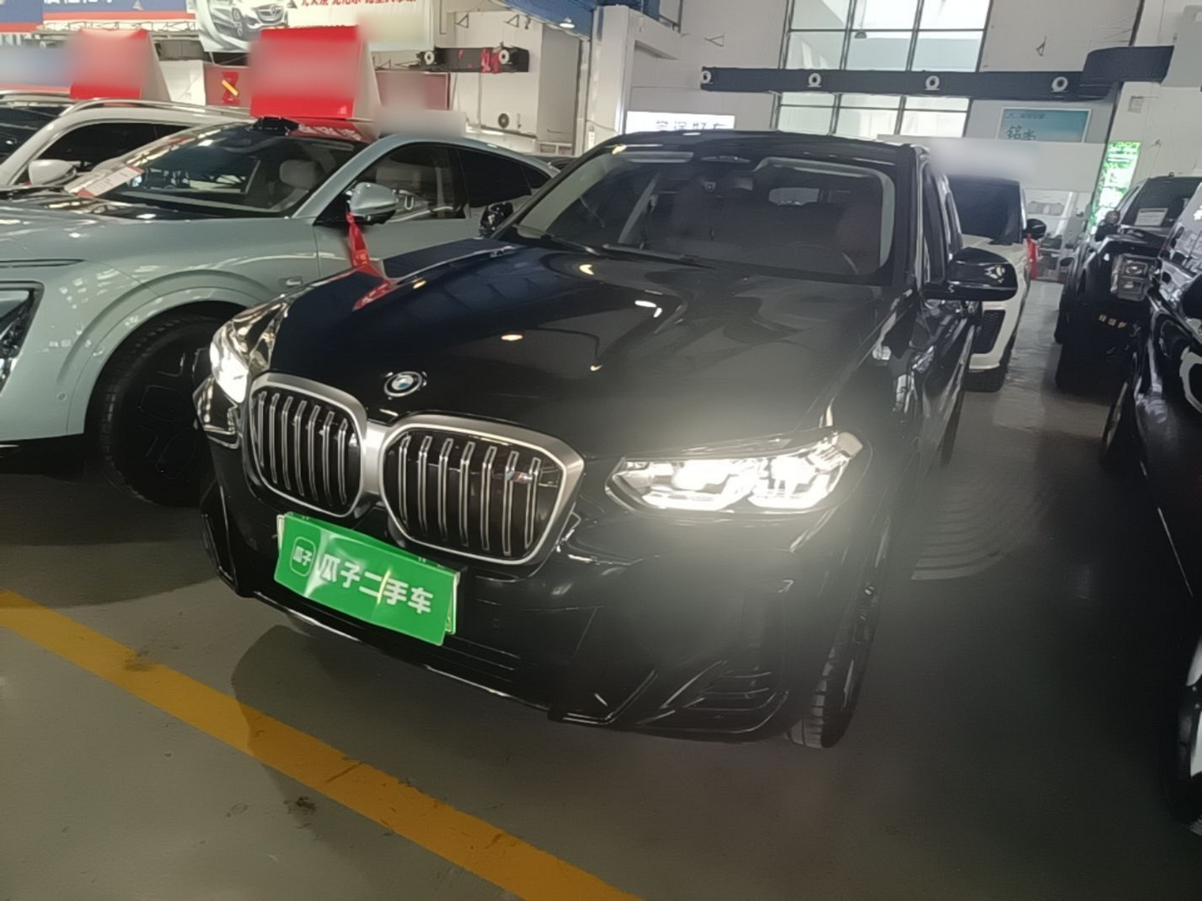 Under the front of the car