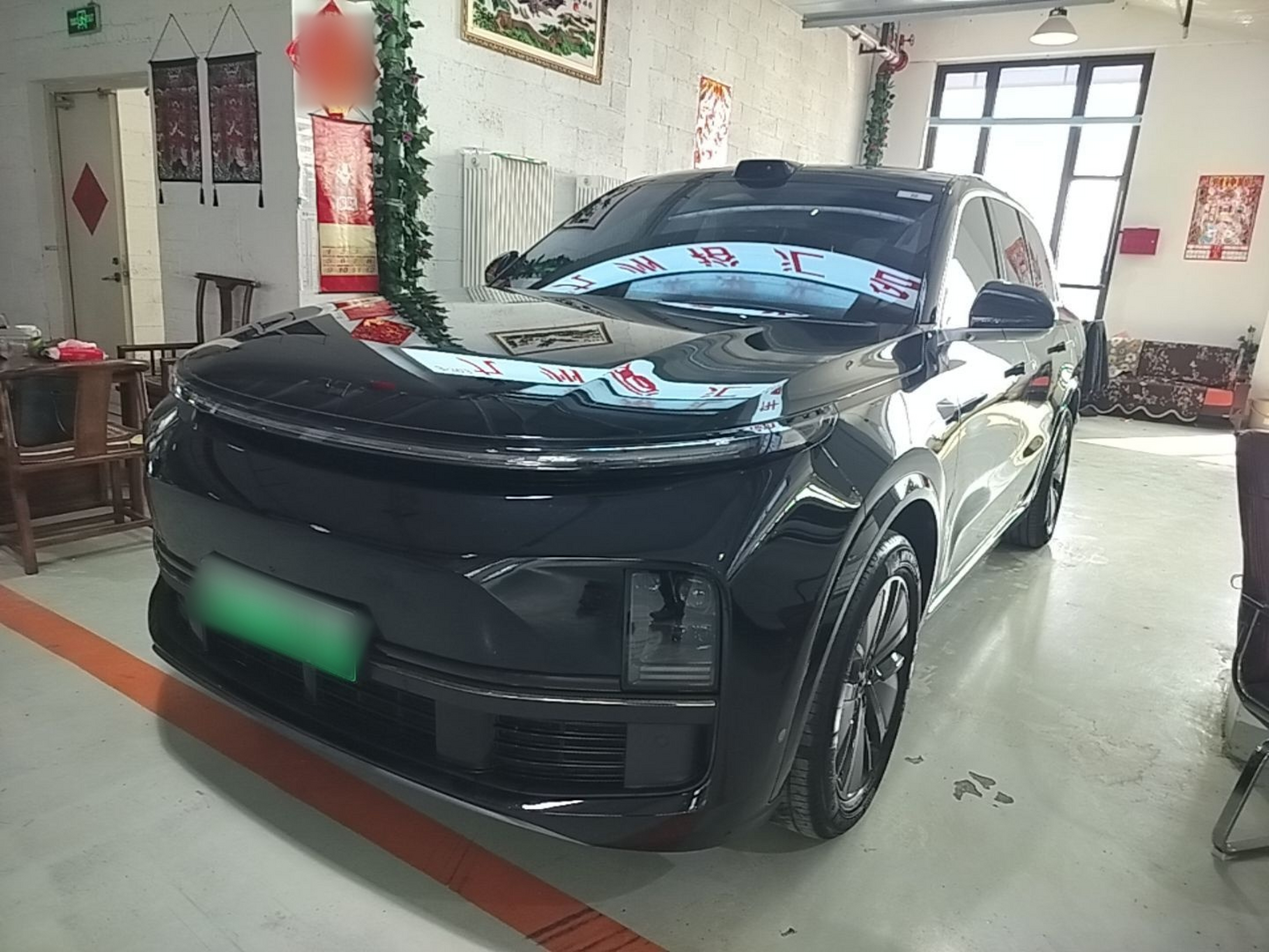 Under the front of the car