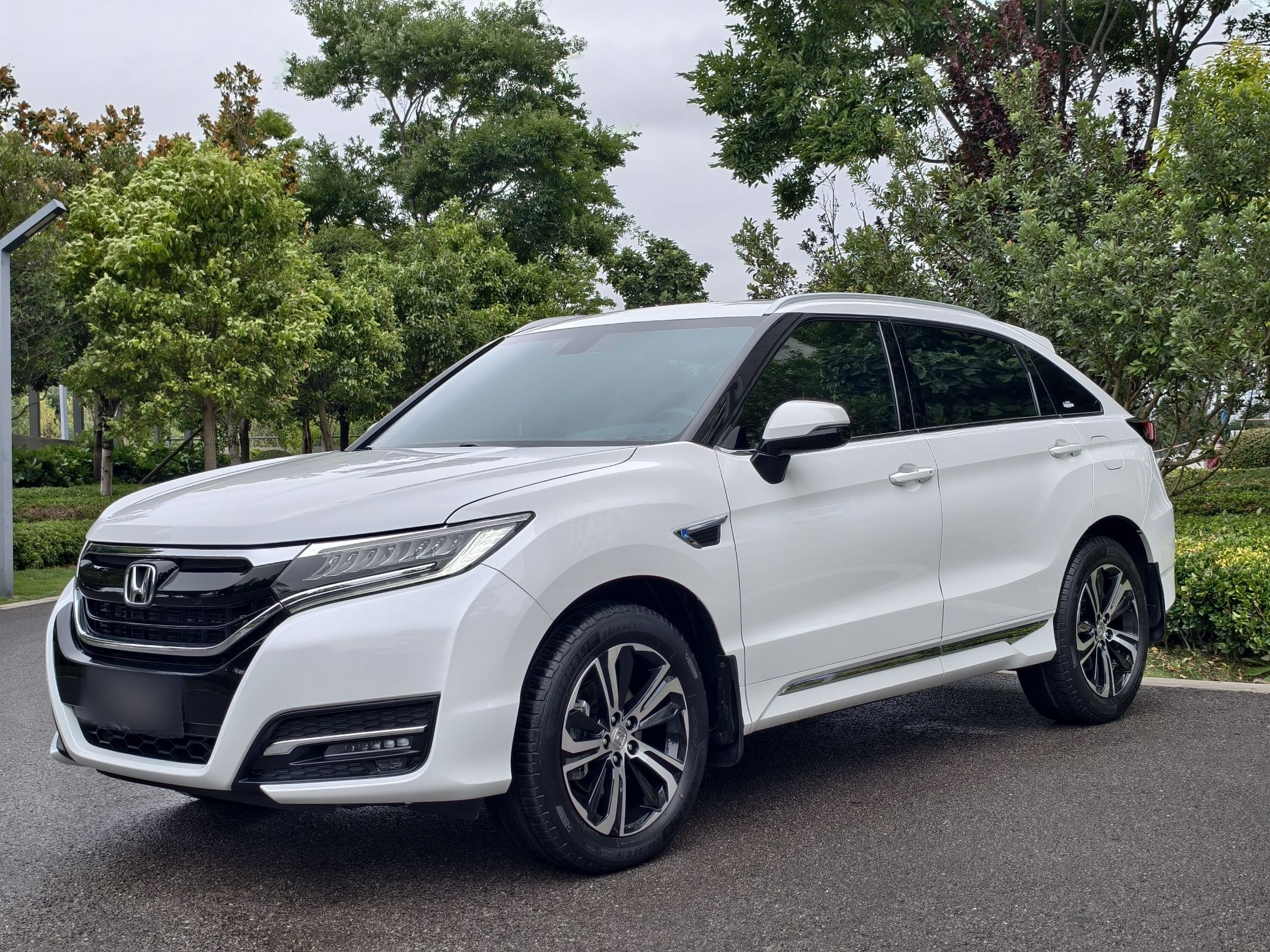 Under the front of the car