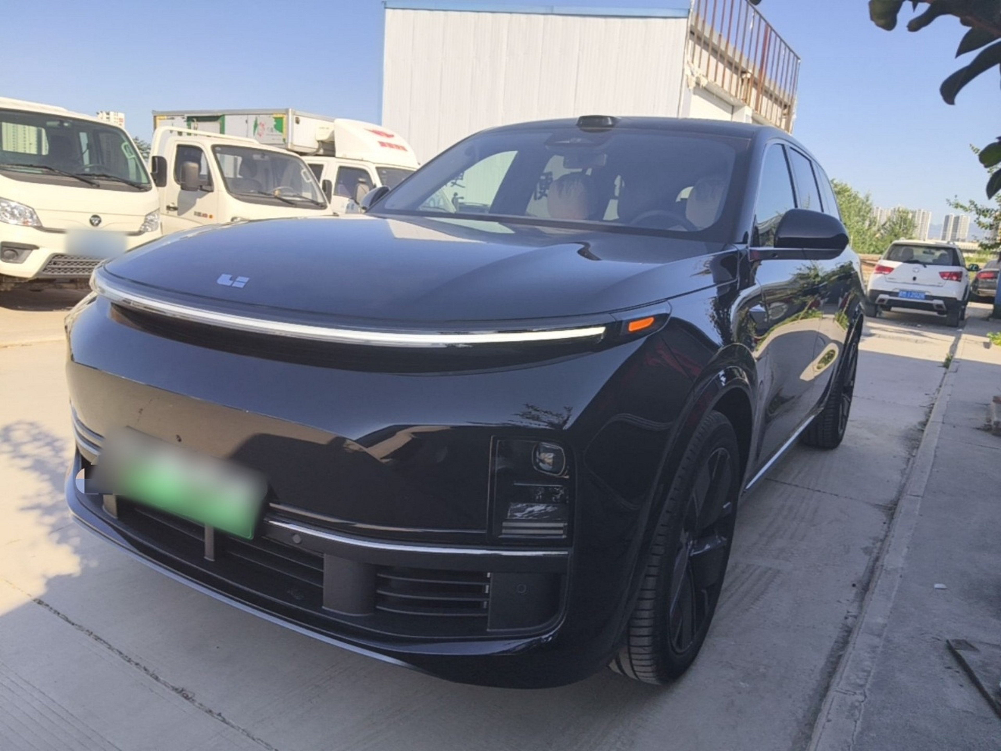 Under the front of the car