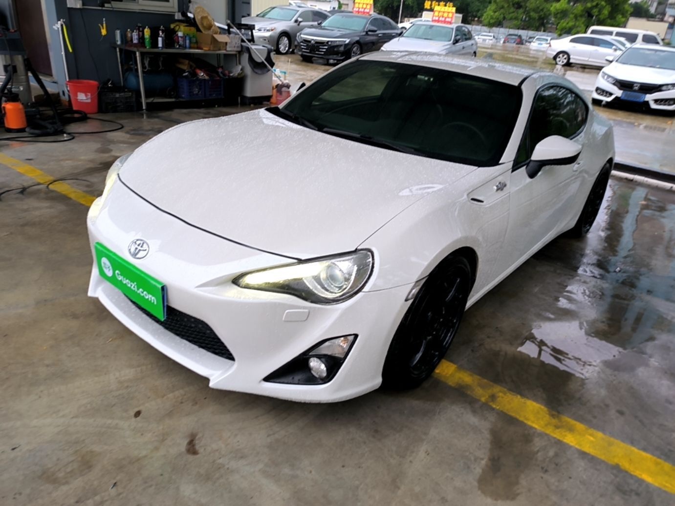 Under the front of the car