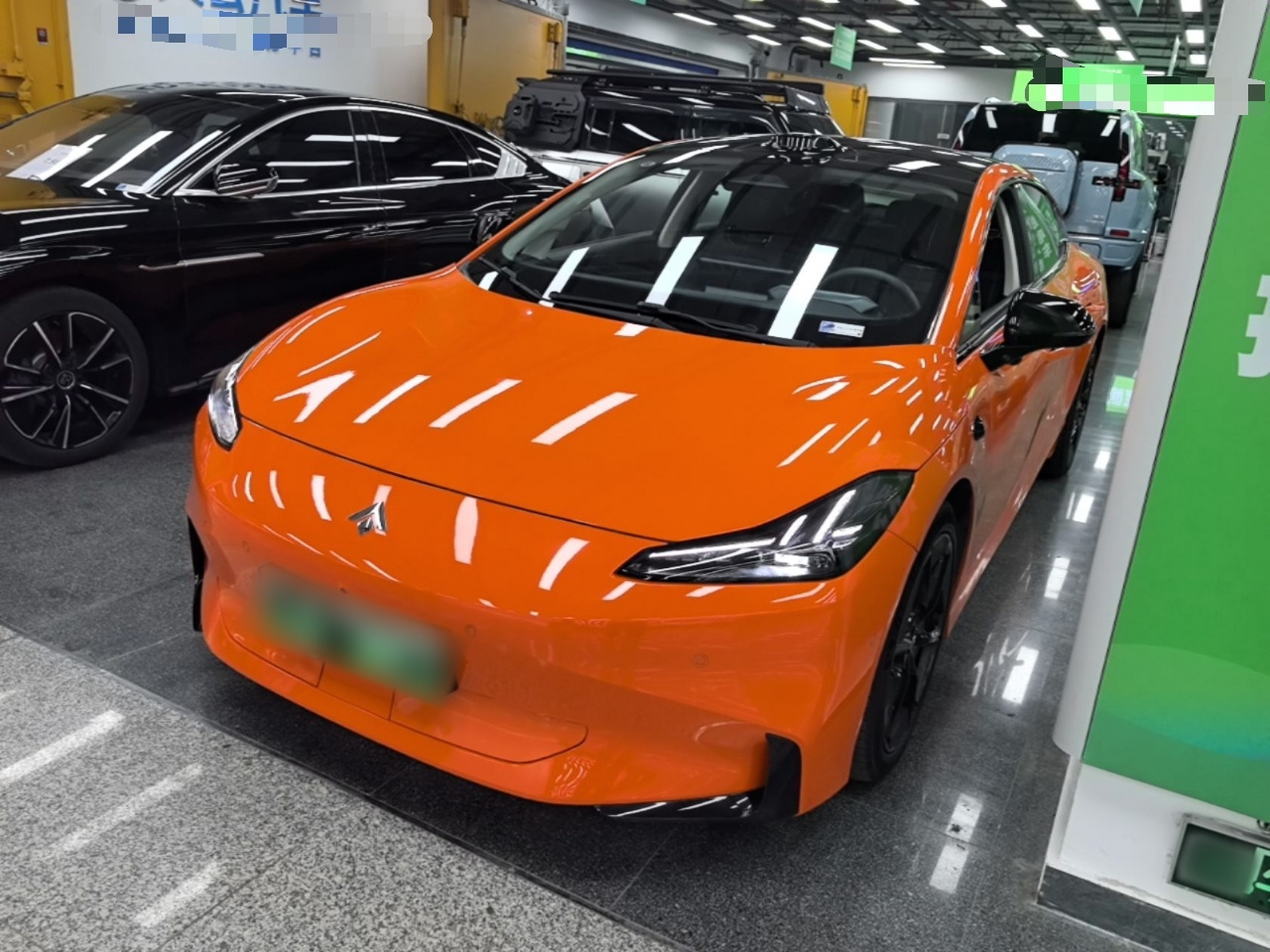 Under the front of the car