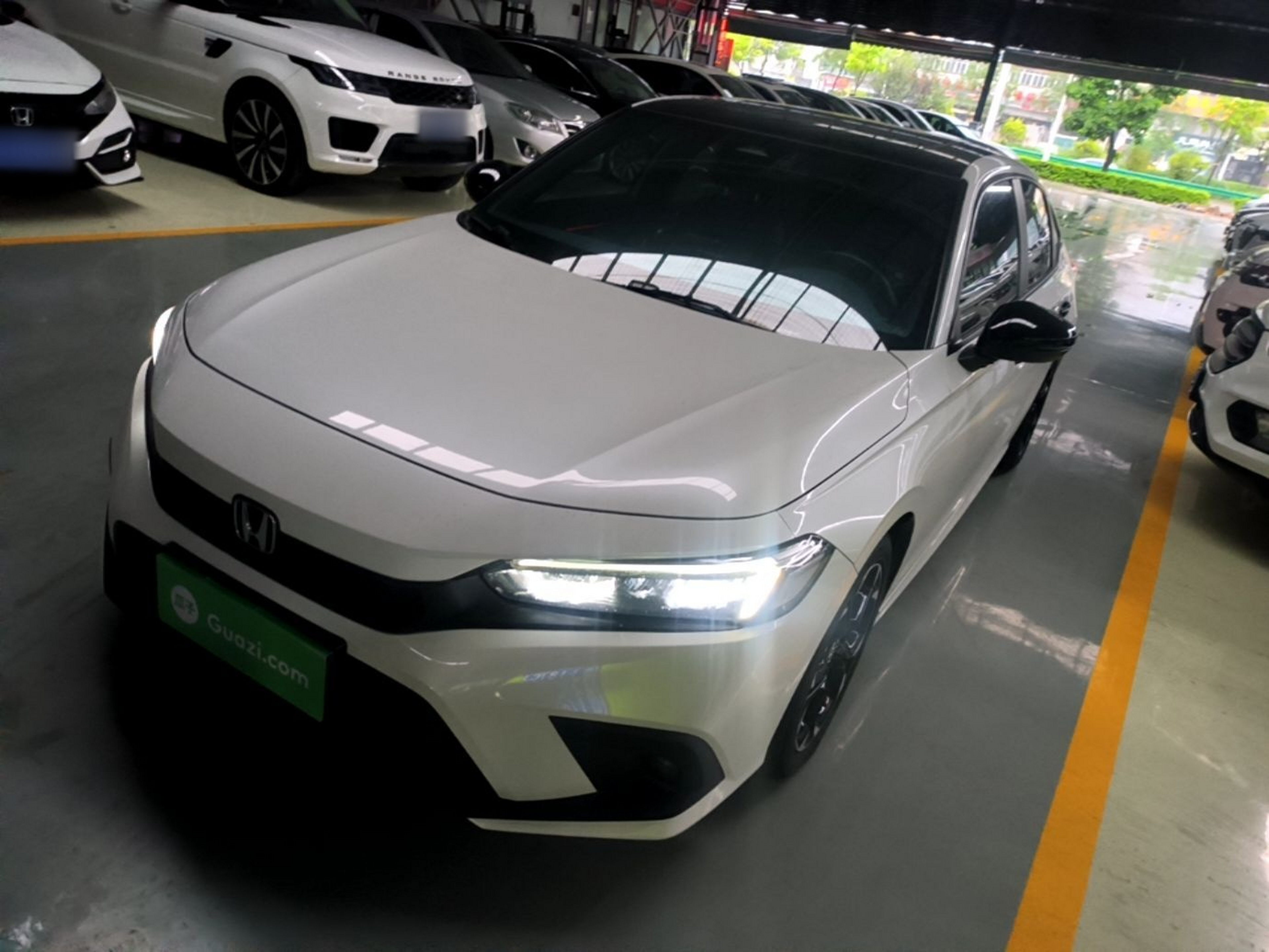 Under the front of the car