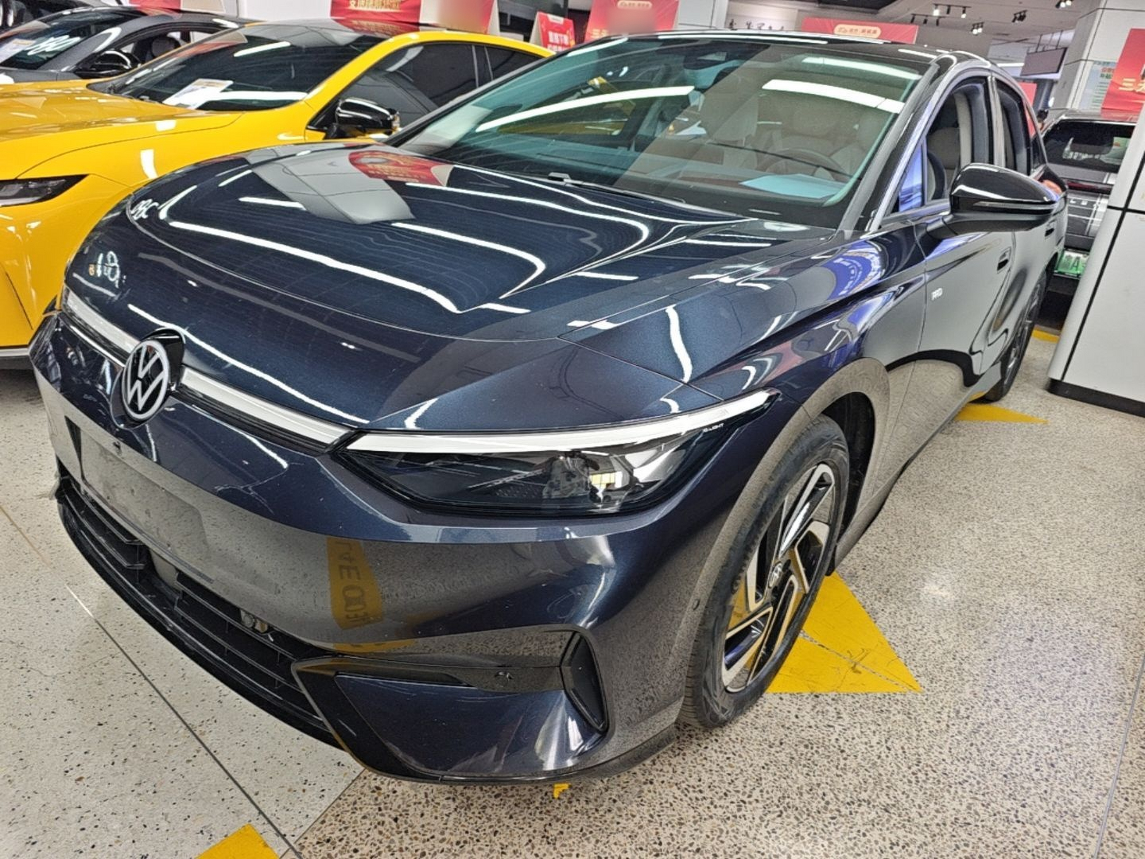Under the front of the car