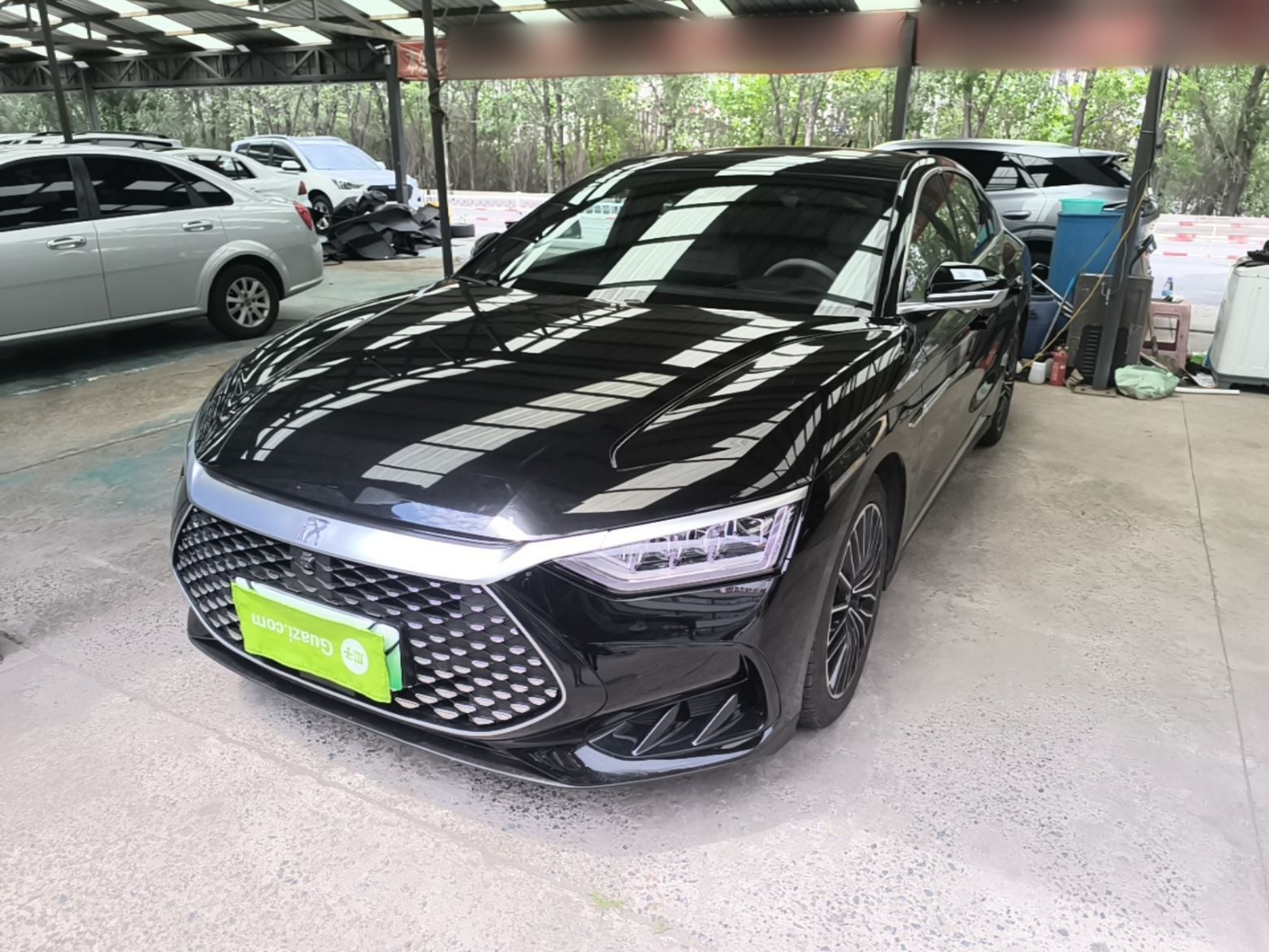 Under the front of the car