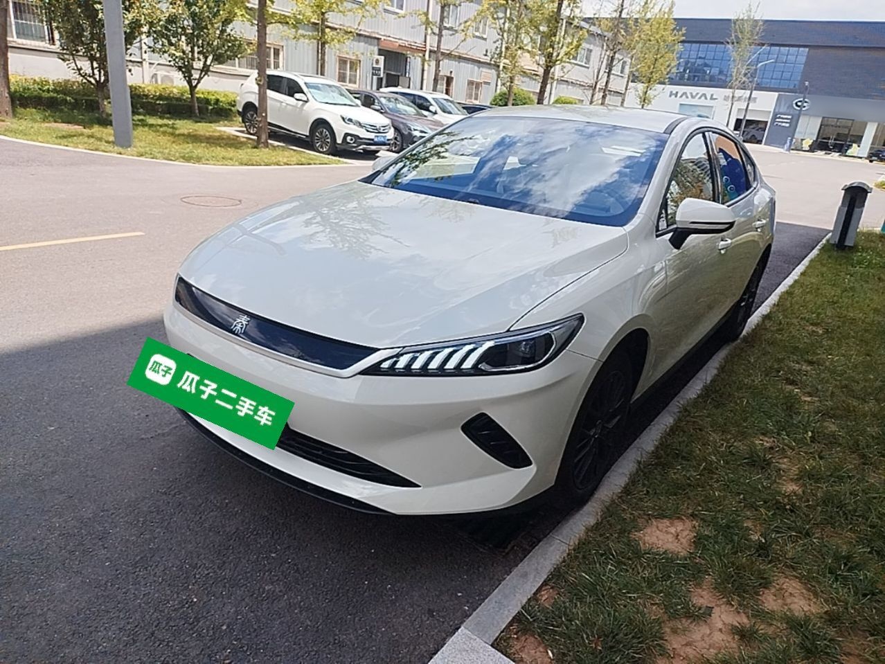 Under the front of the car