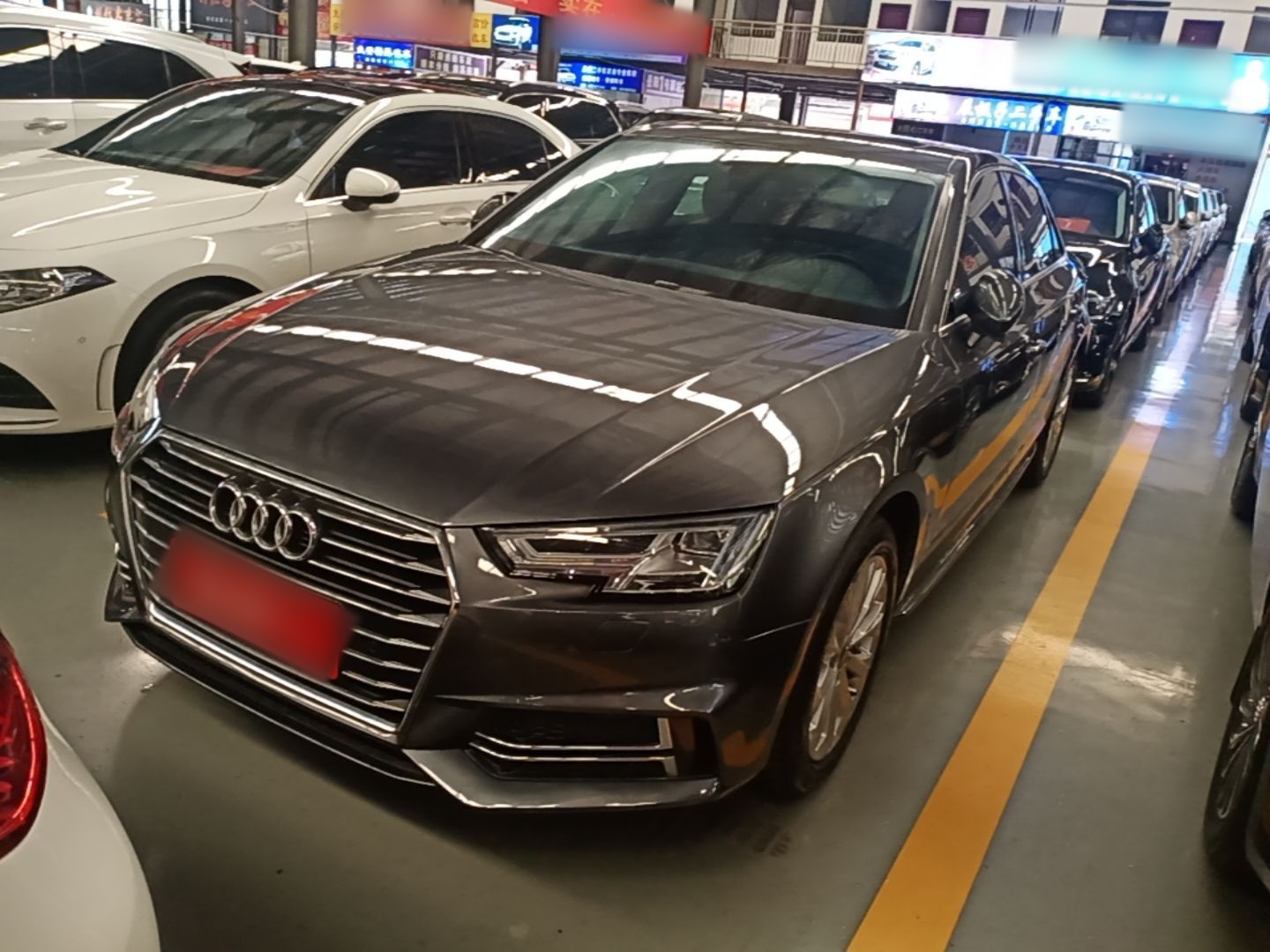 Under the front of the car