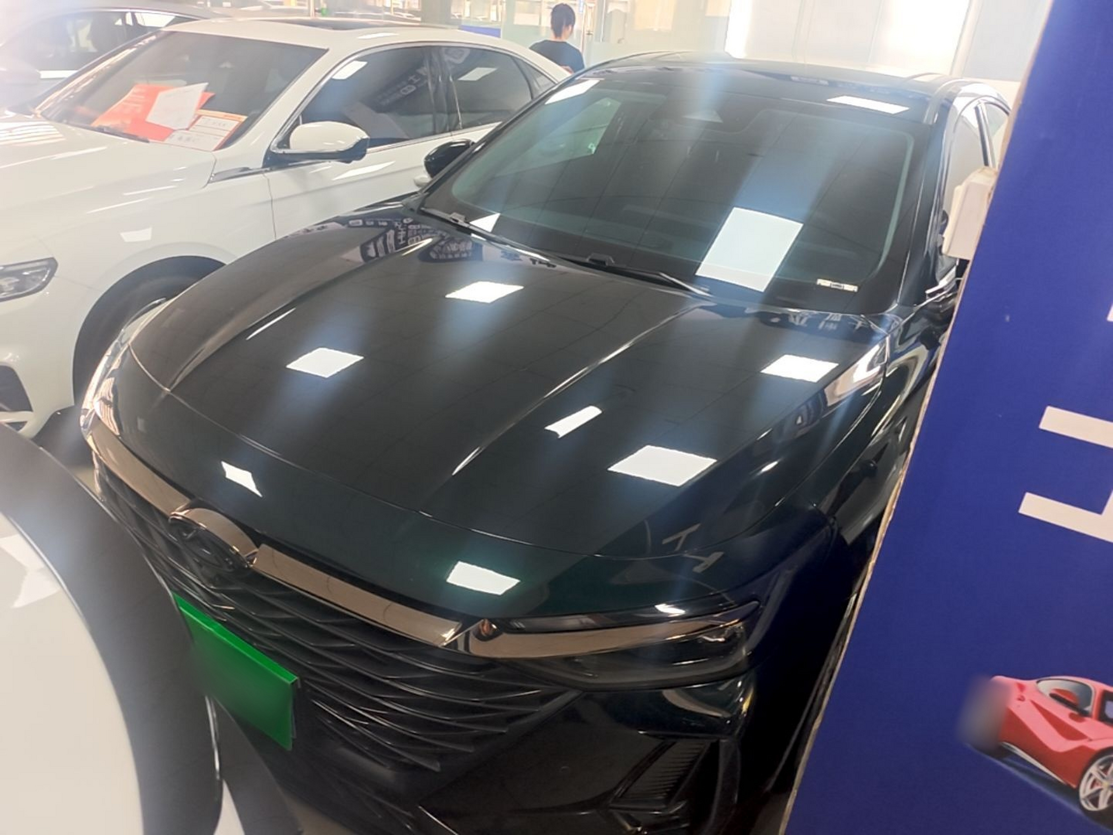Under the front of the car