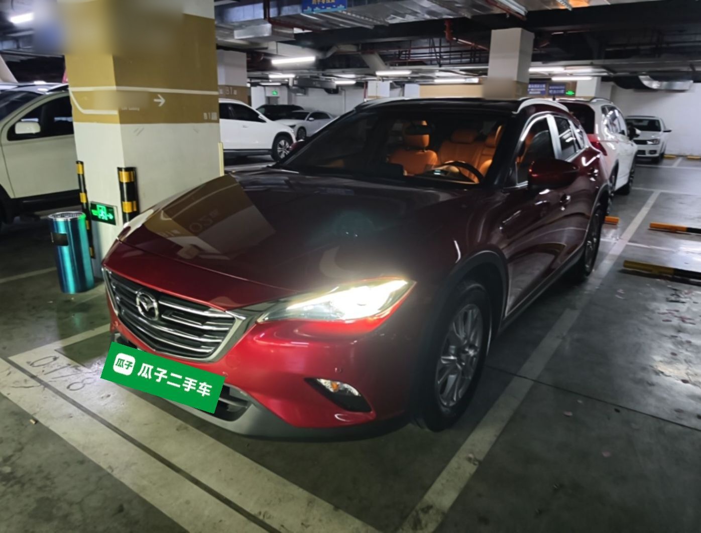 Under the front of the car