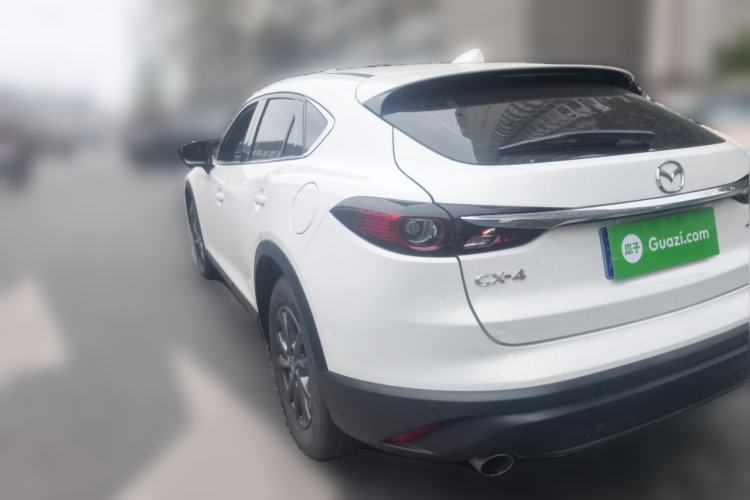 Used Mazda CX-4 2021 2.0L Automatic Two-Wheel Drive Blue Sky Dynamic Edition Rear Left 45 Deg