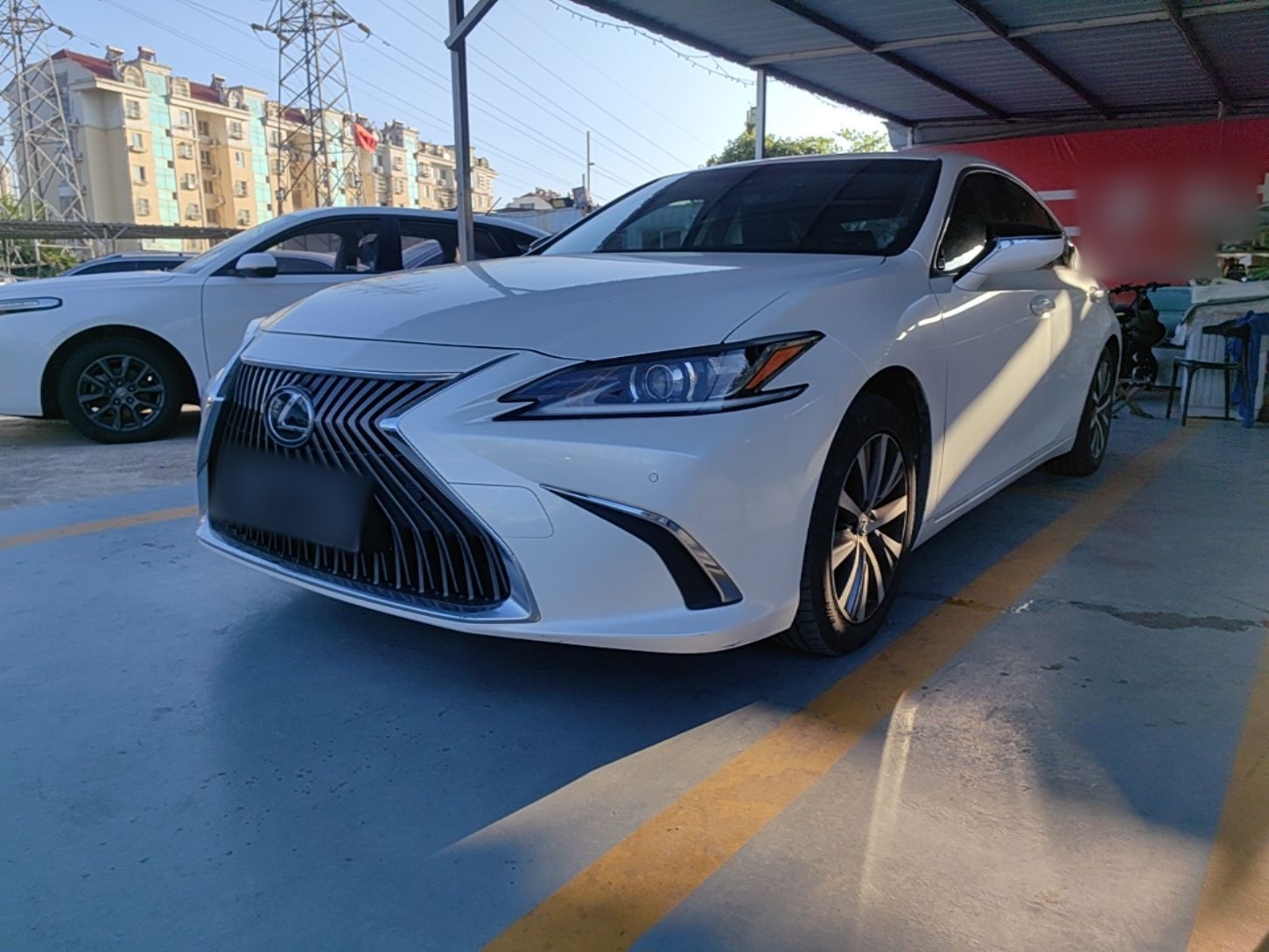 Under the front of the car