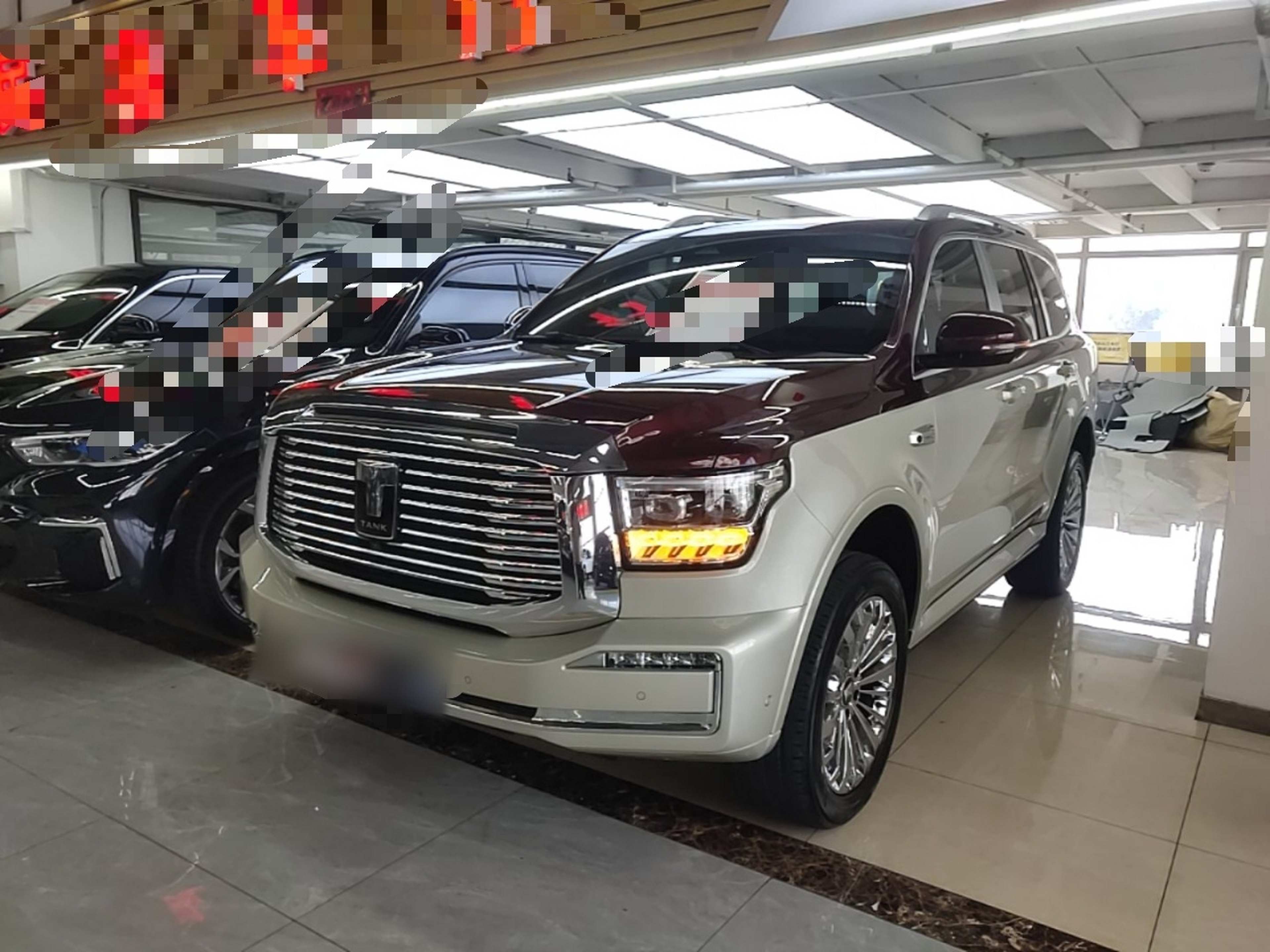 Under the front of the car