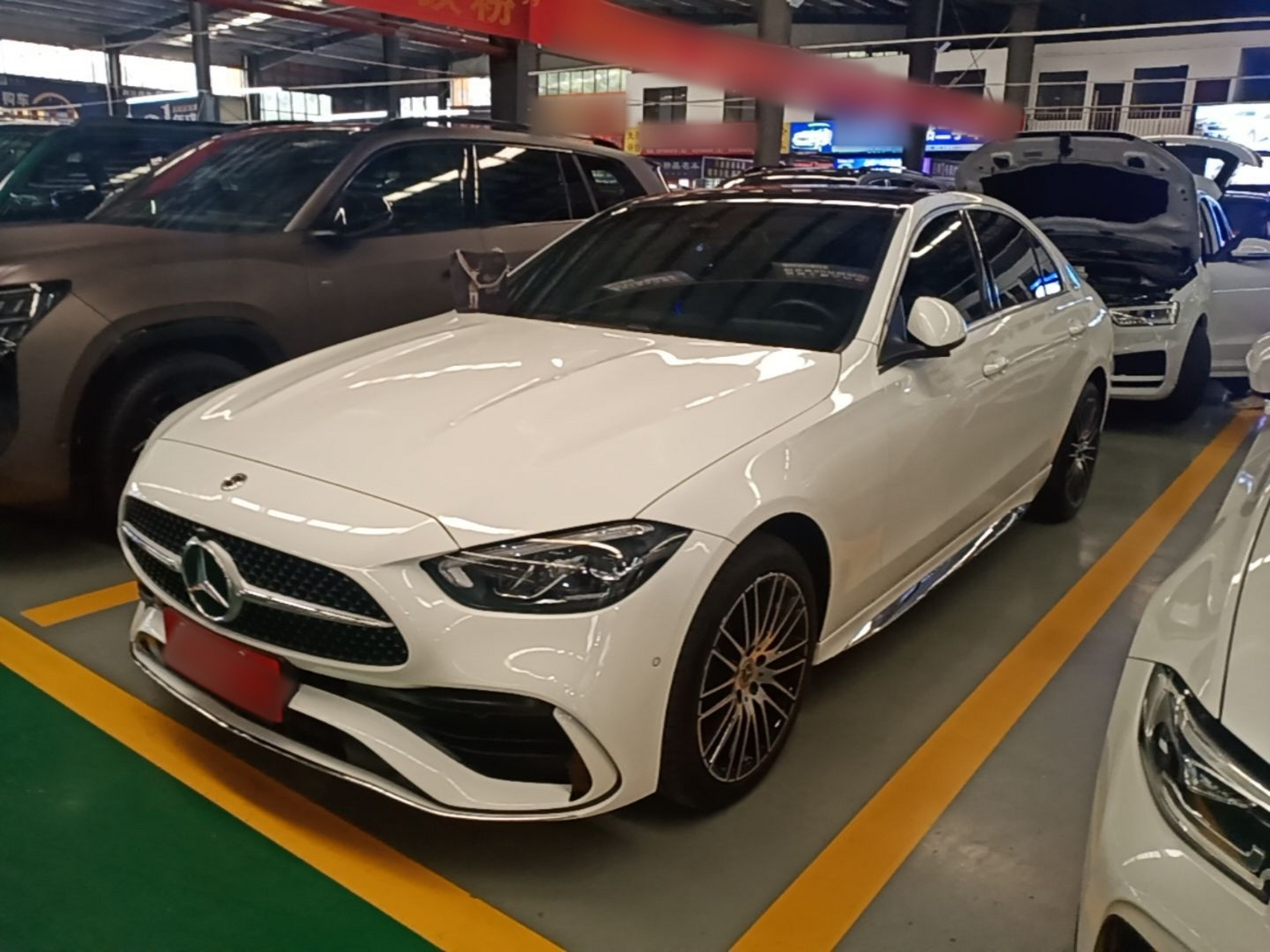 Under the front of the car