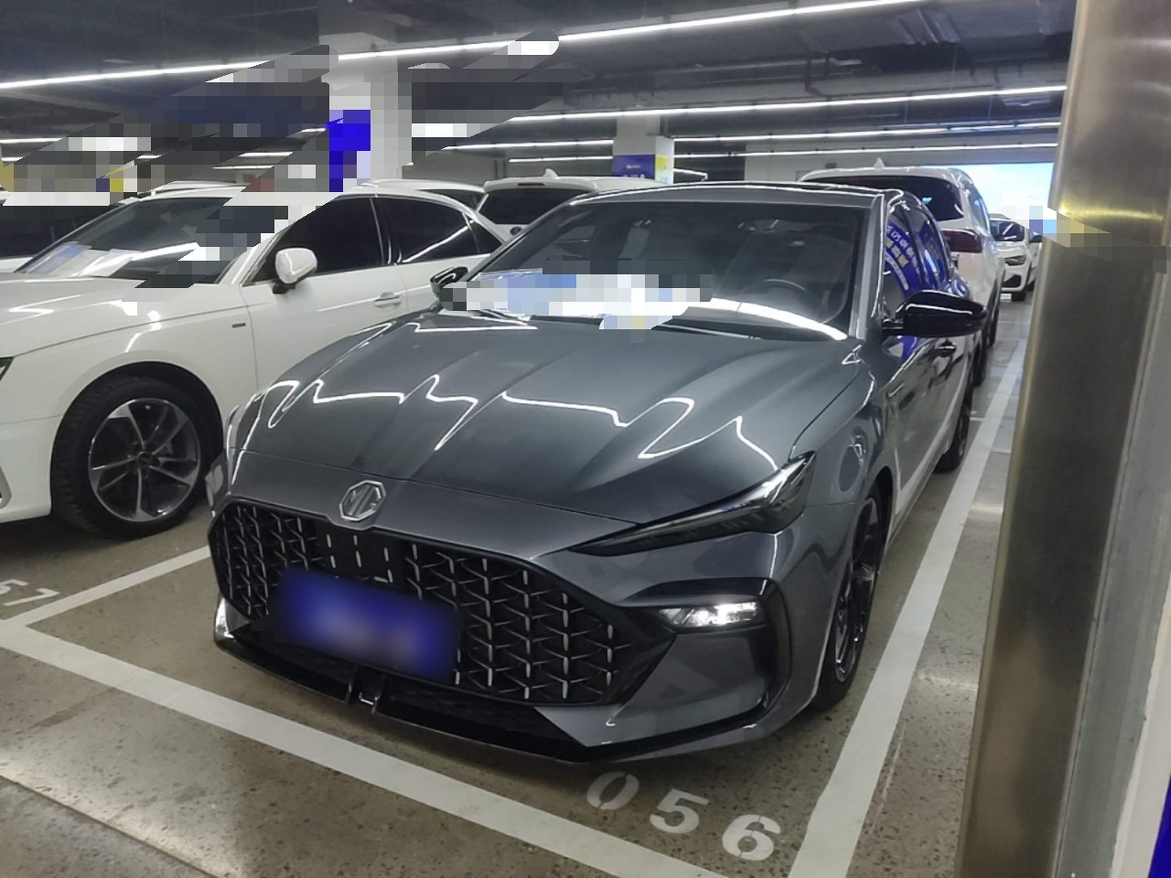 Under the front of the car