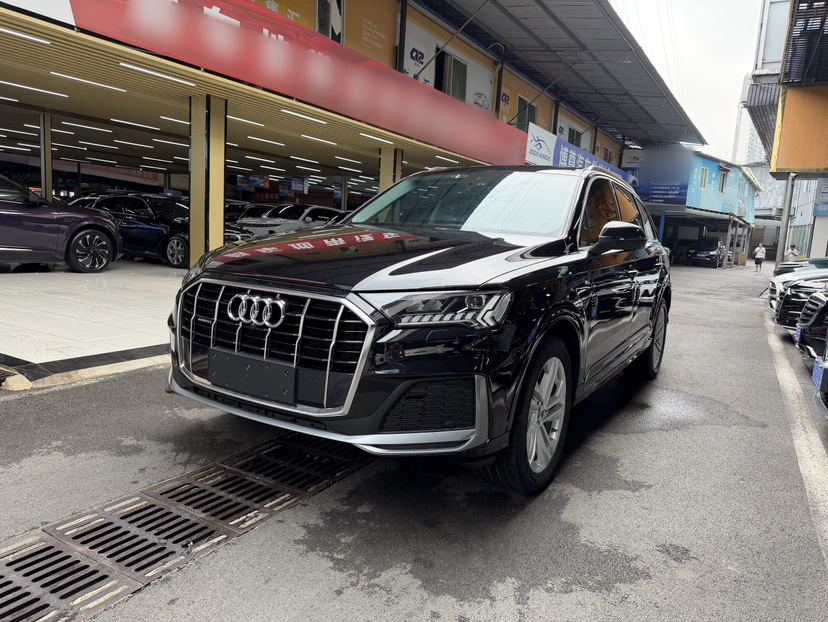 Under the front of the car