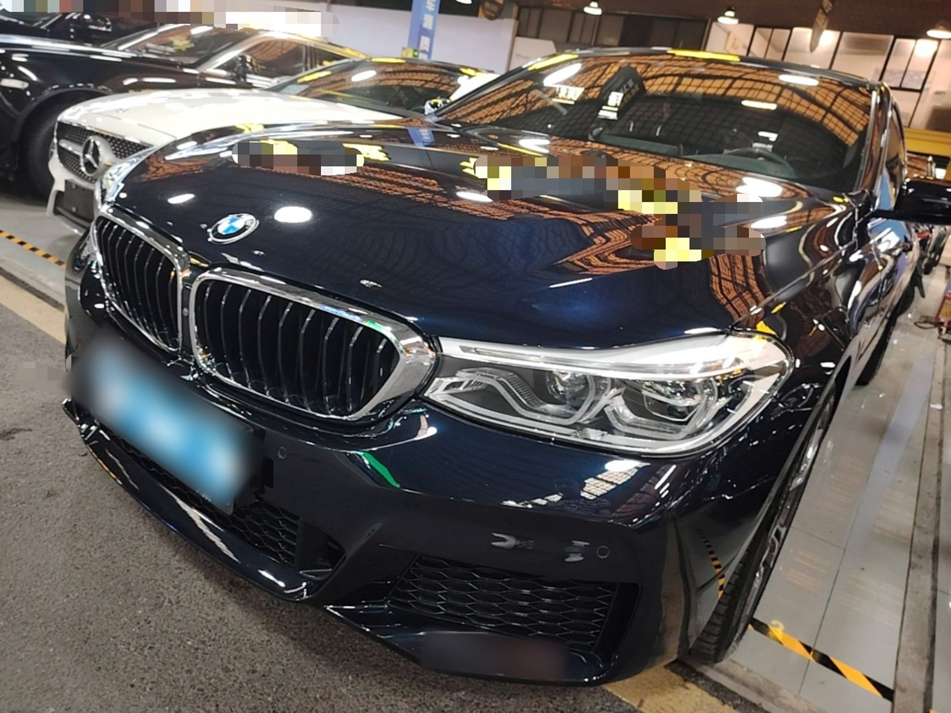 Under the front of the car