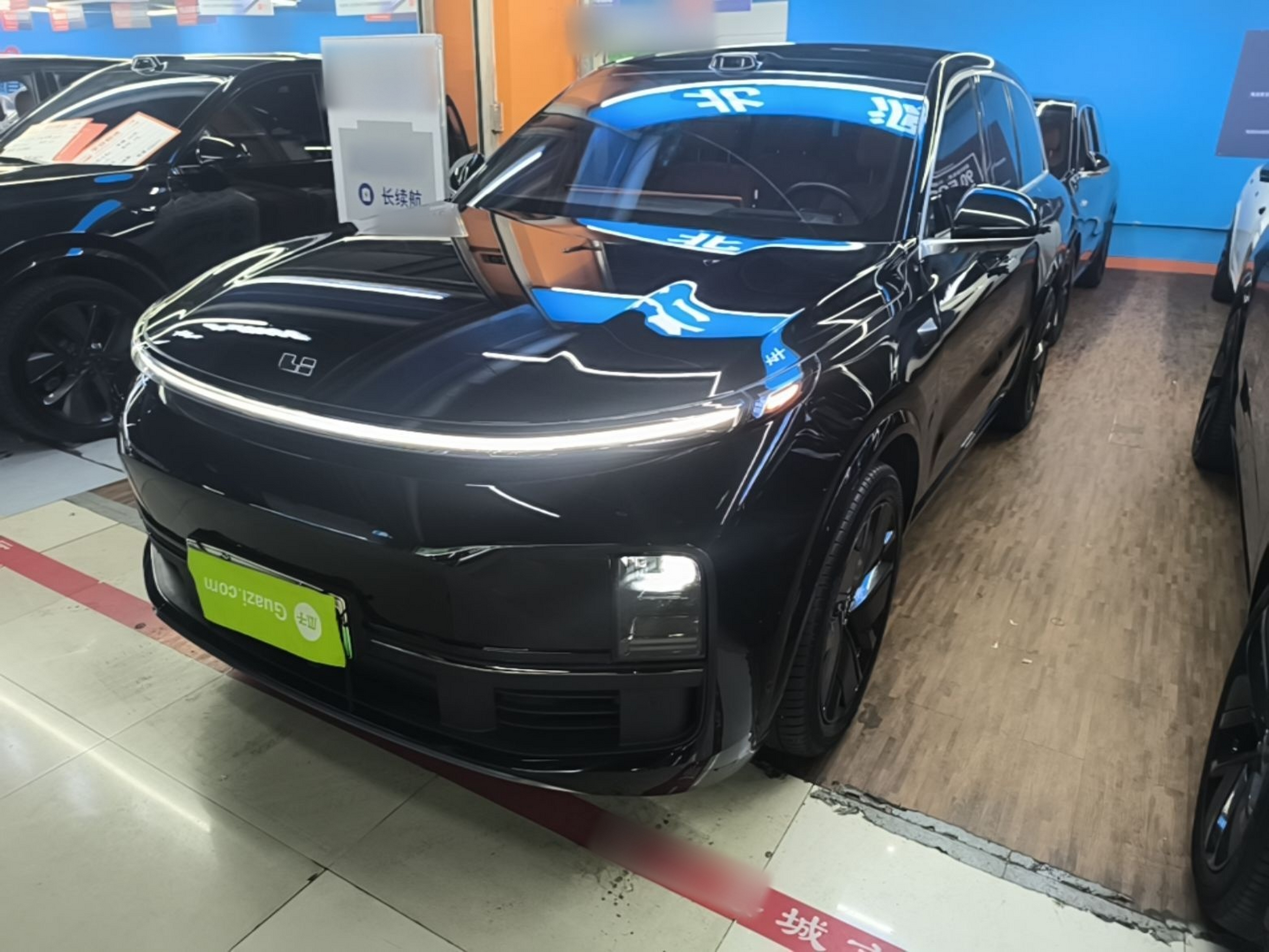 Under the front of the car