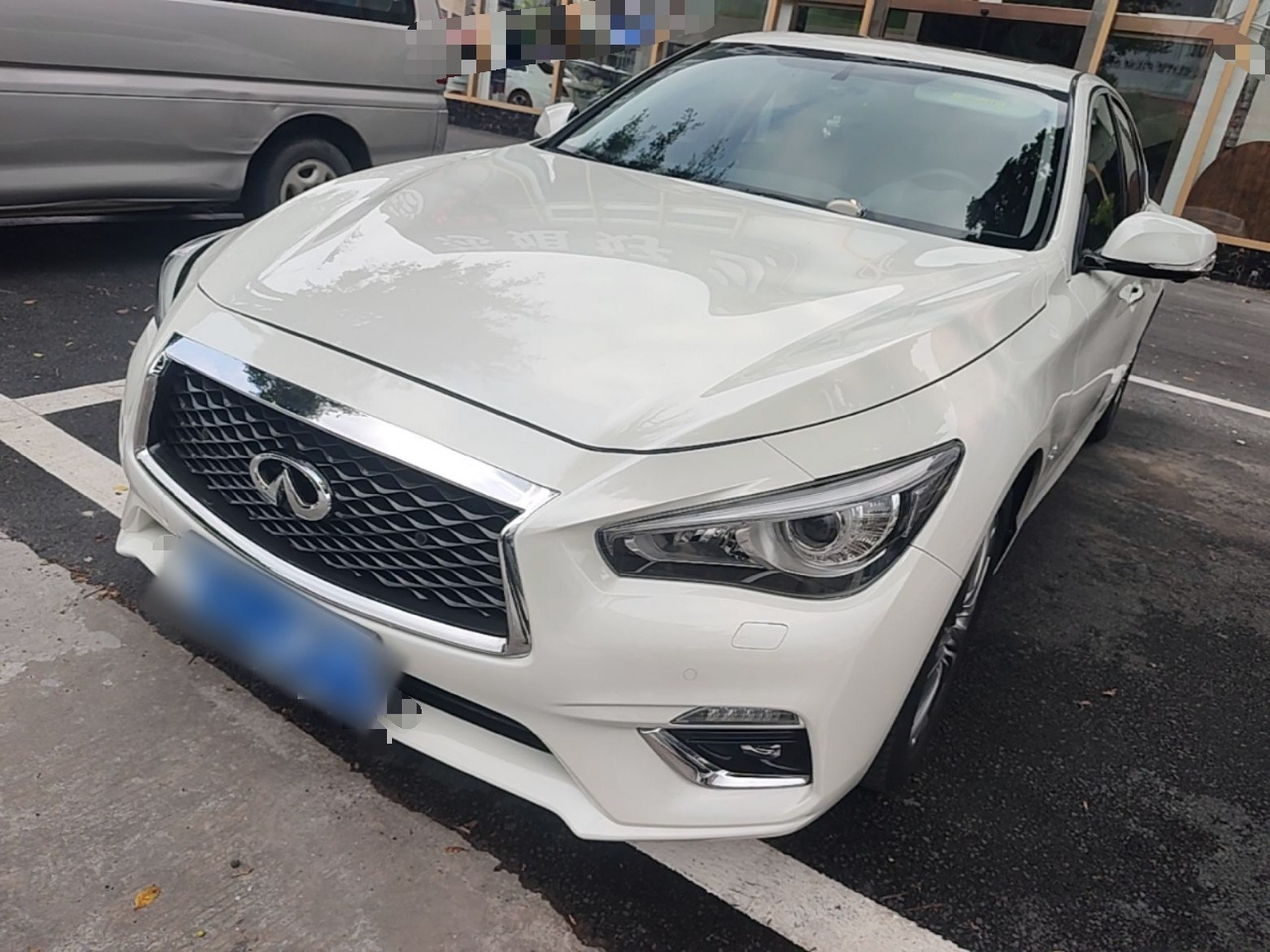 Under the front of the car