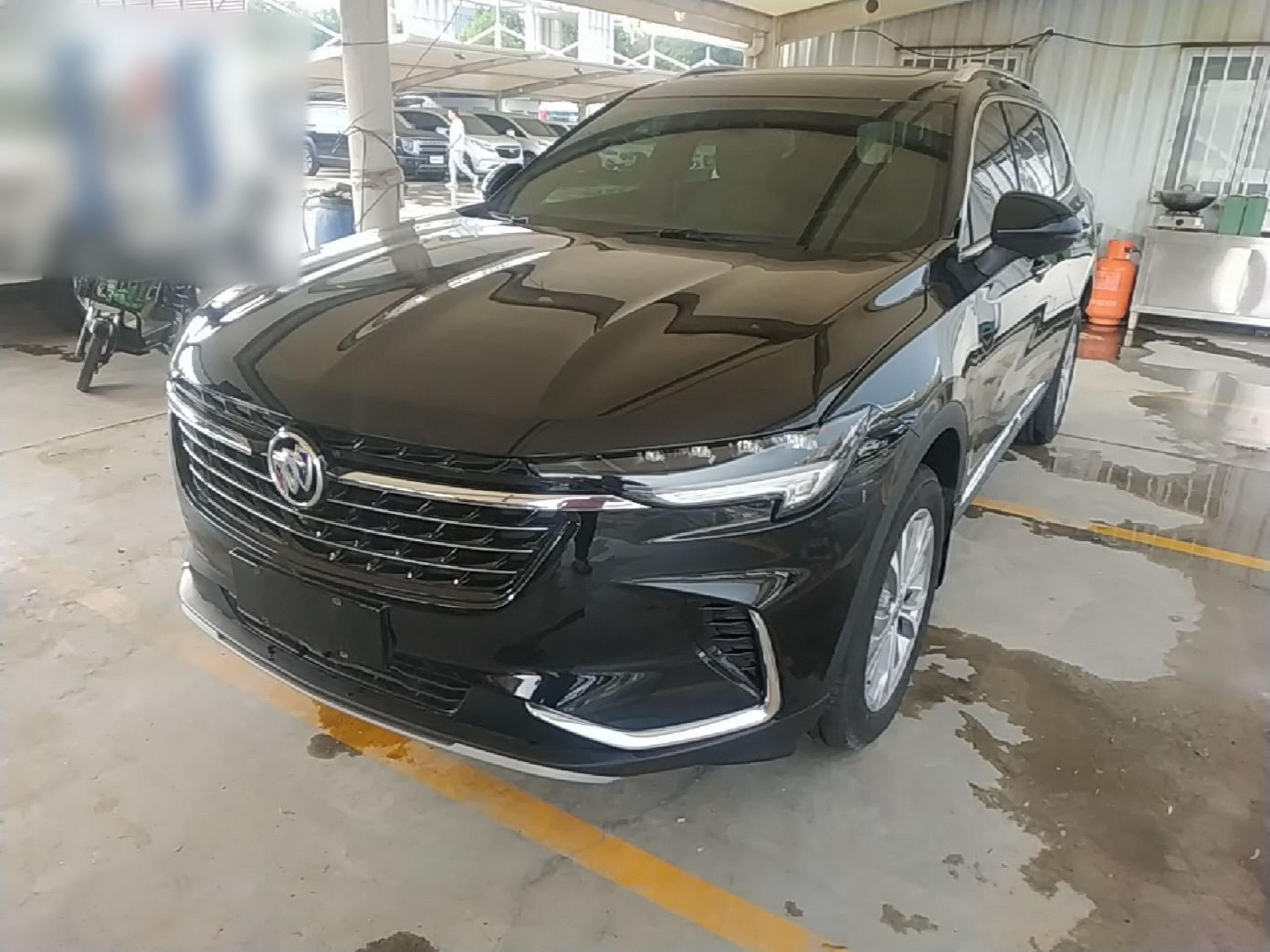 Under the front of the car