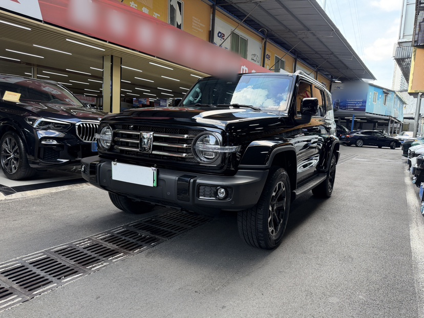 Under the front of the car