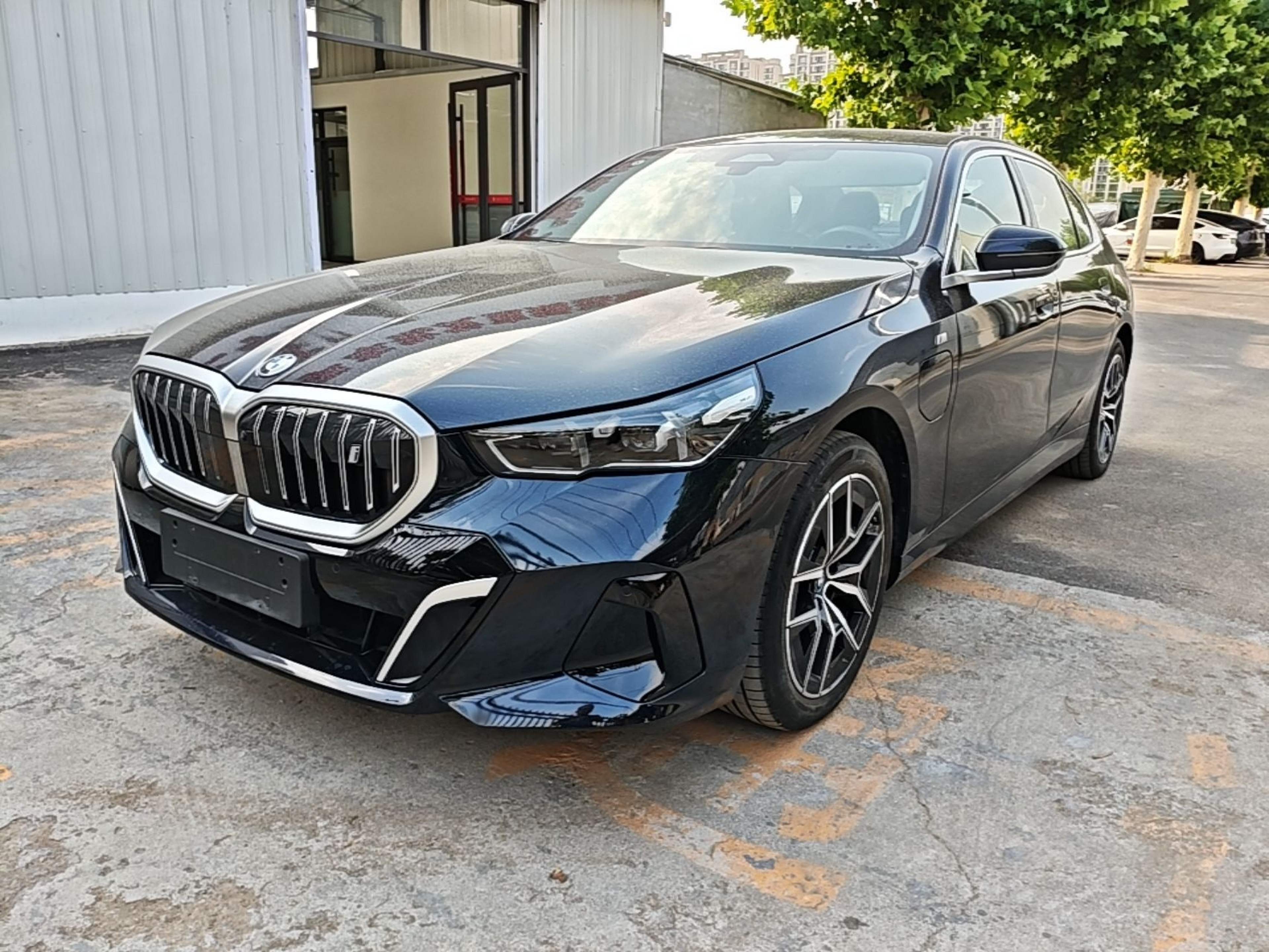Under the front of the car