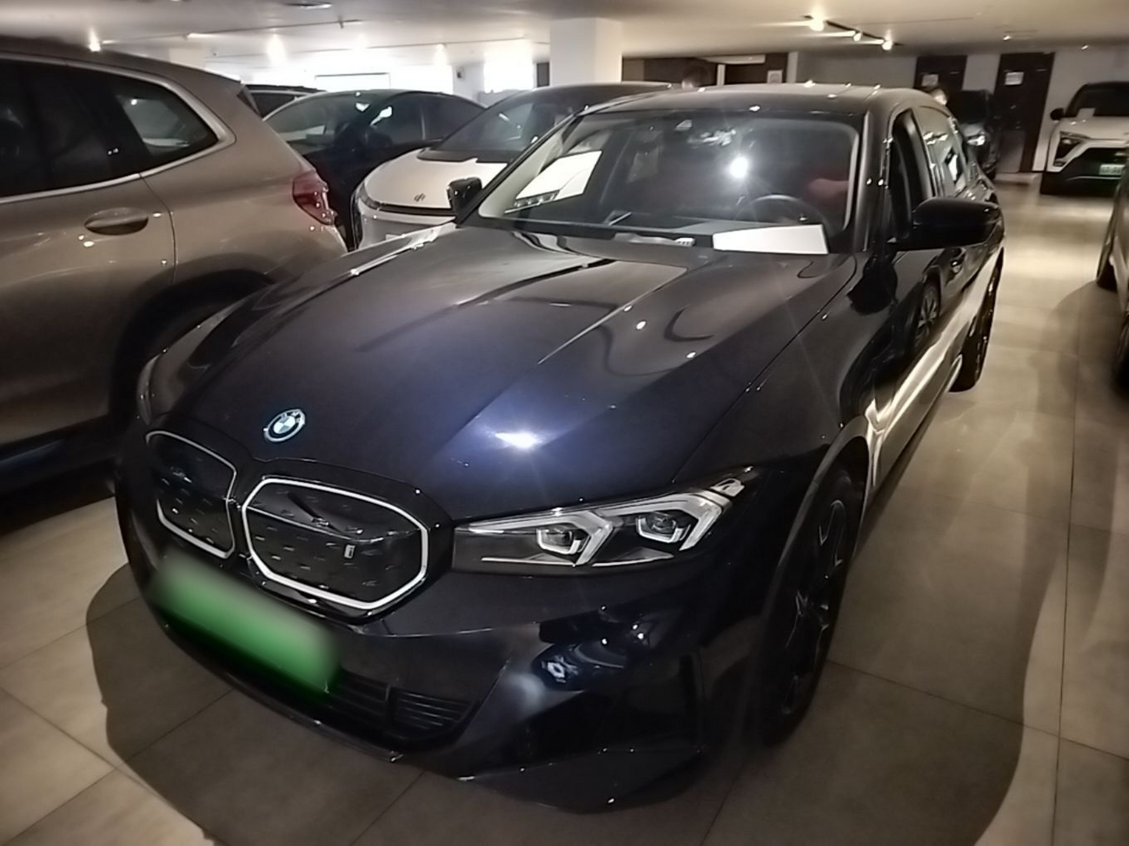 Under the front of the car