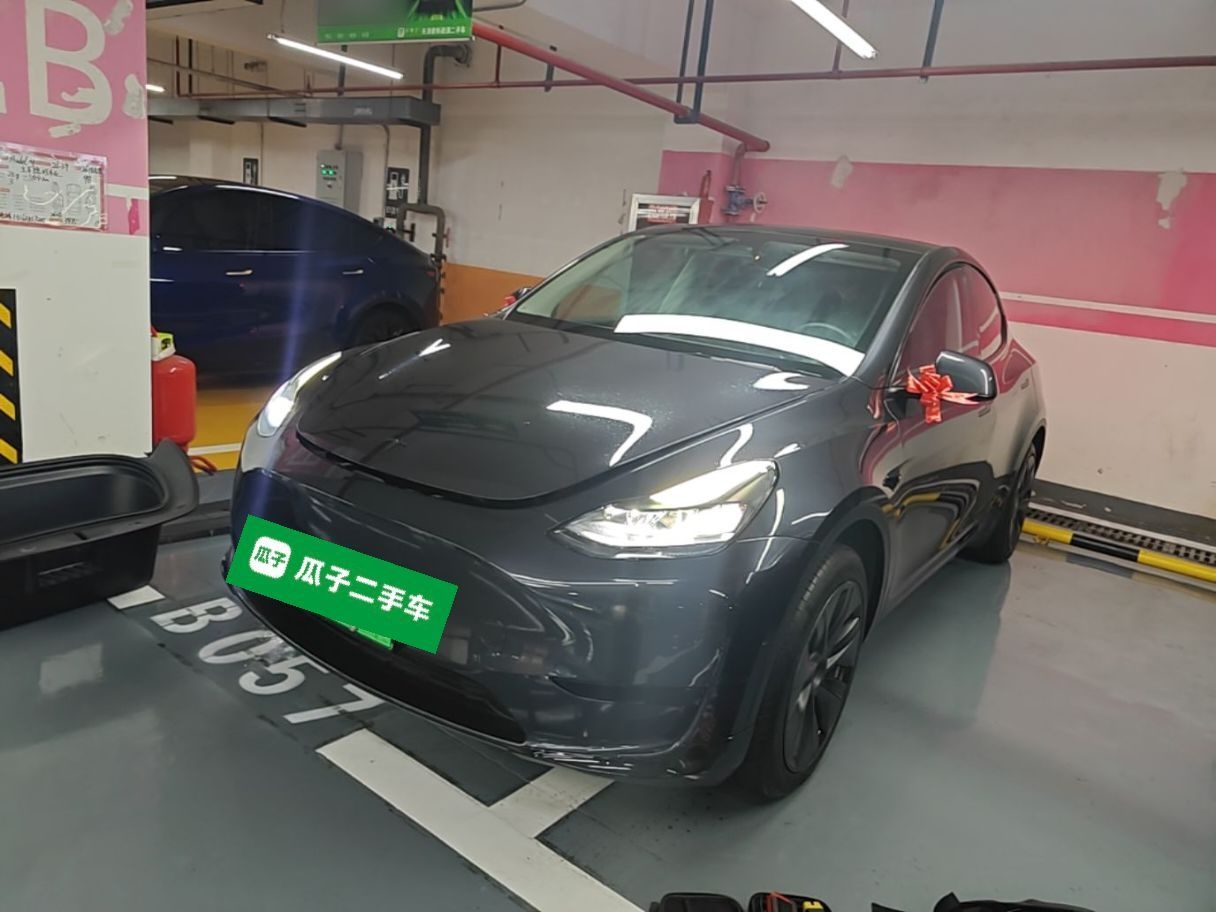 Under the front of the car