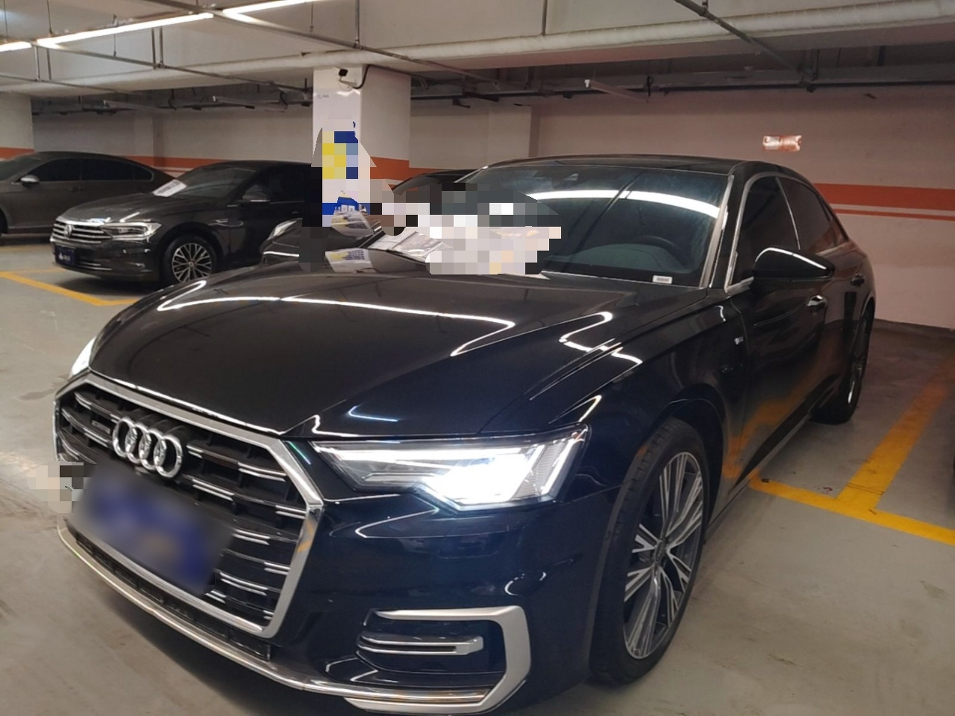Under the front of the car