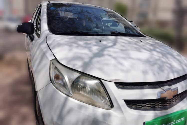 Used Chevrolet Sail 2013 Sedan 1.2L Manual Fashionable Happiness Edition Front Right 45 Deg