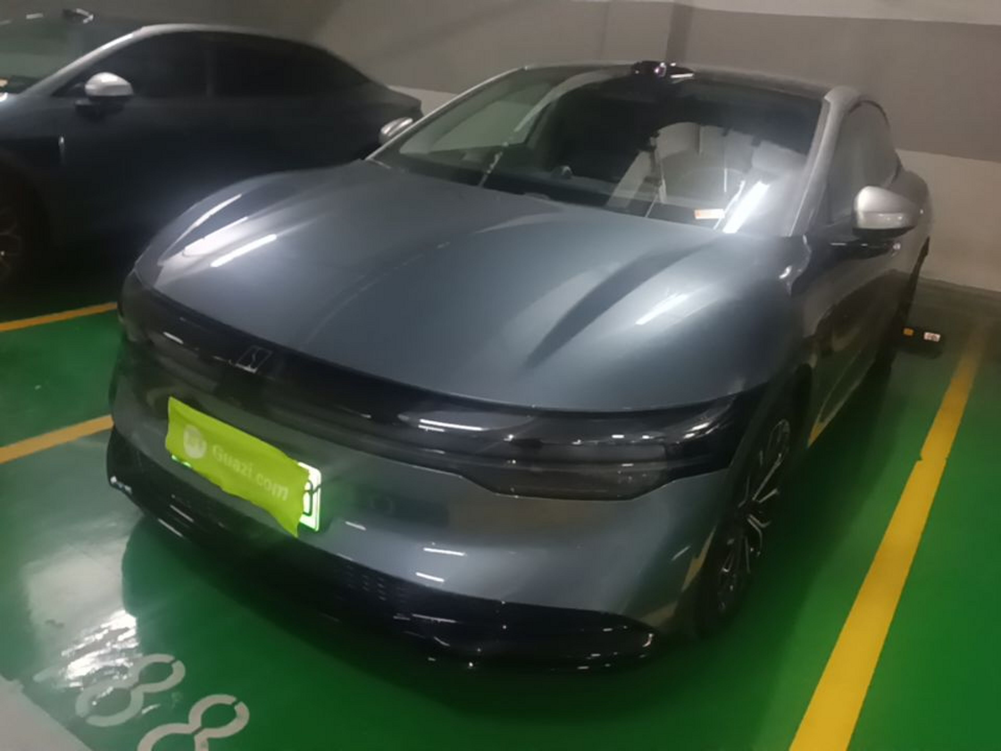 Under the front of the car