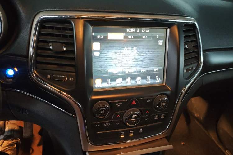 Used Jeep Grand Cherokee 2014 3.6L Elite Navigation Edition Audio And AC Panel