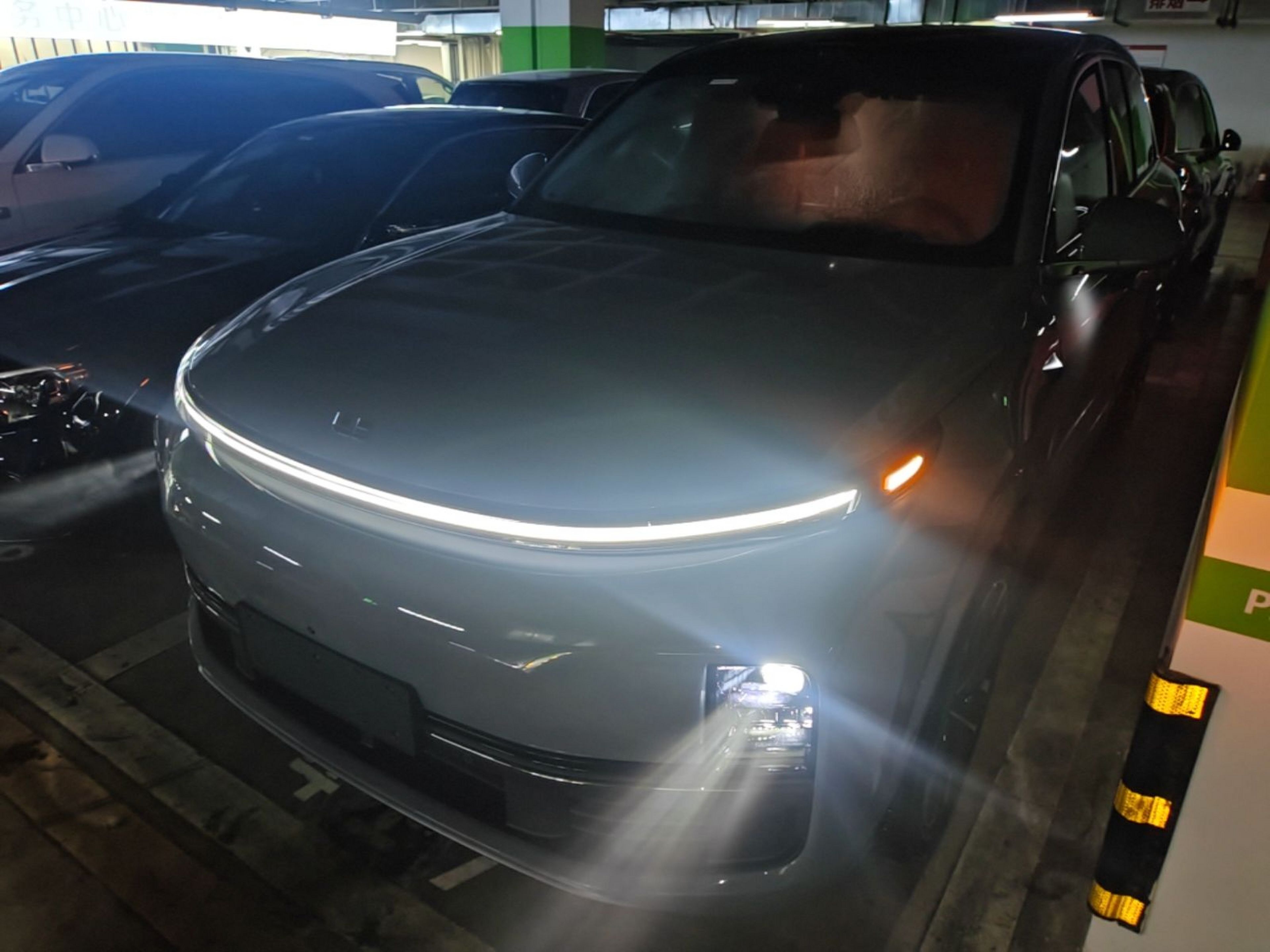 Under the front of the car
