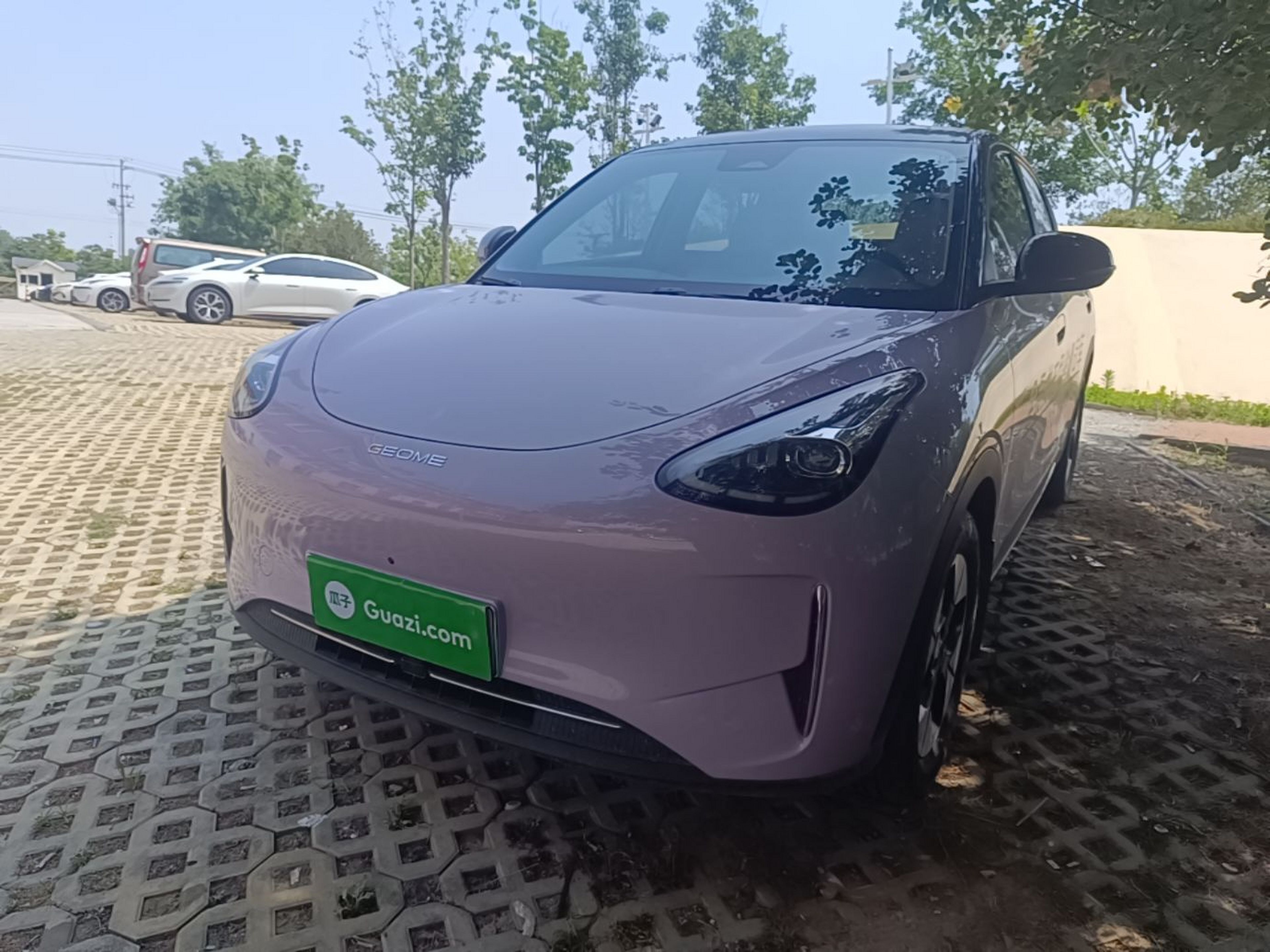 Under the front of the car