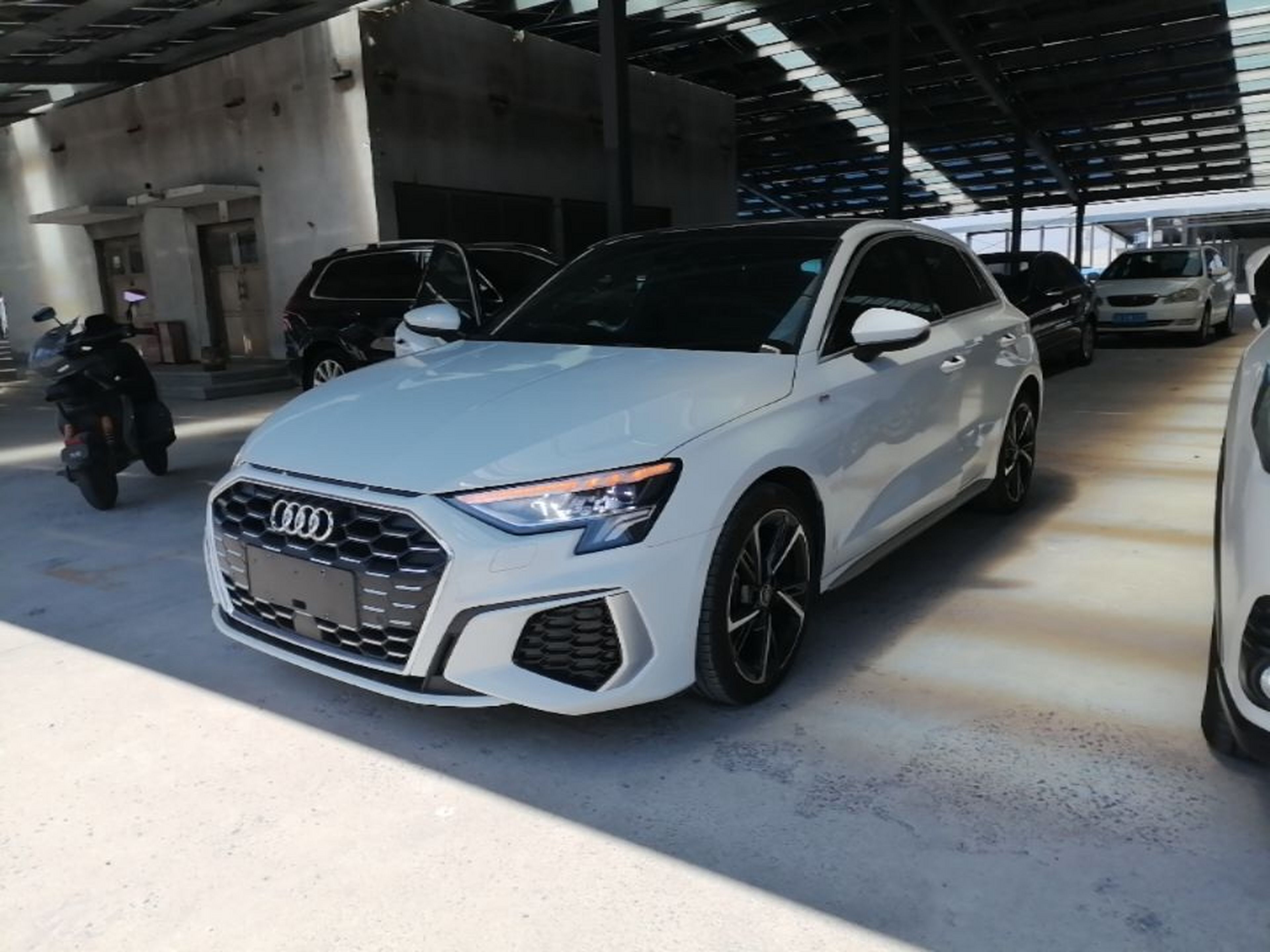 Under the front of the car