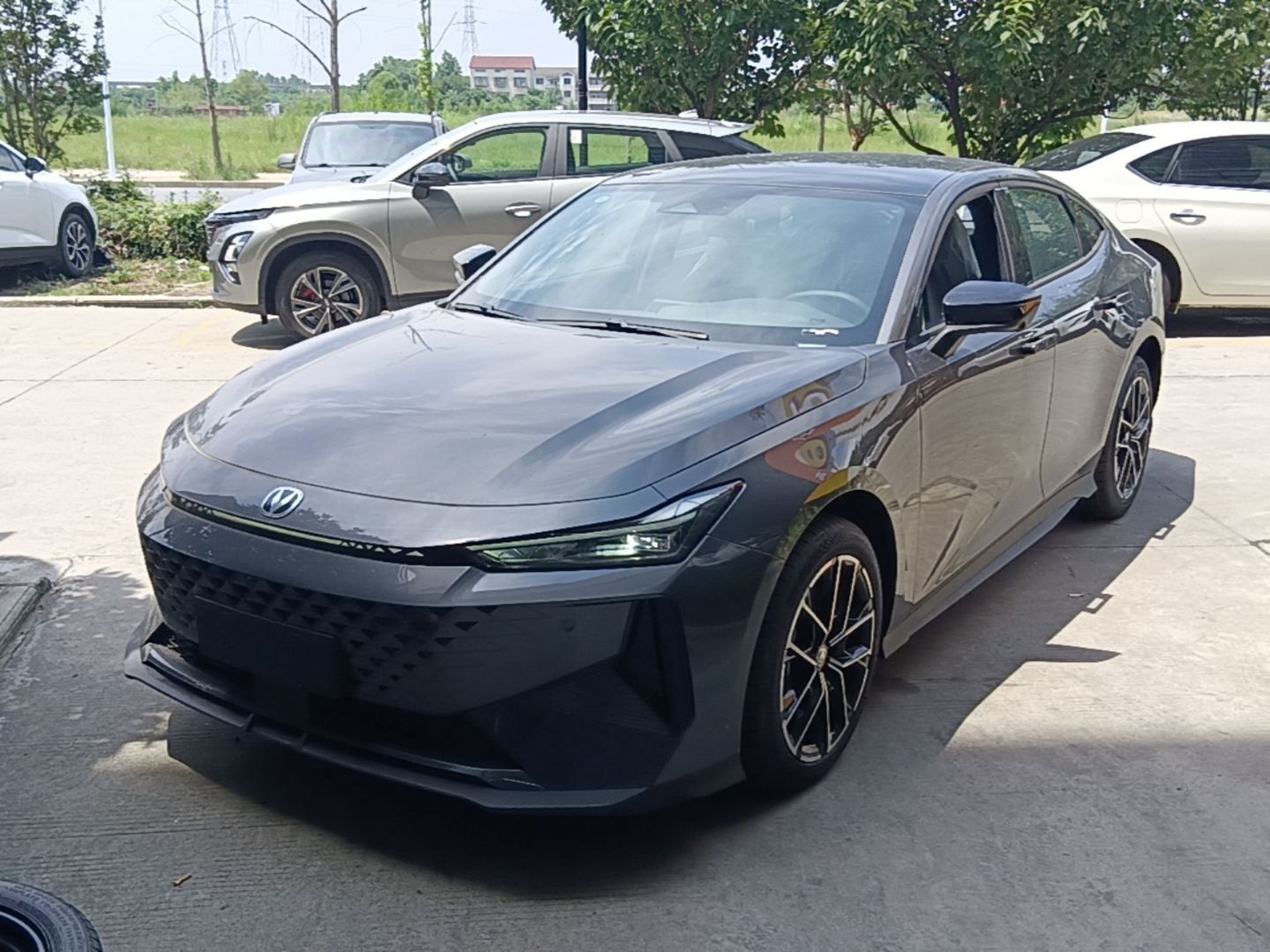 Under the front of the car