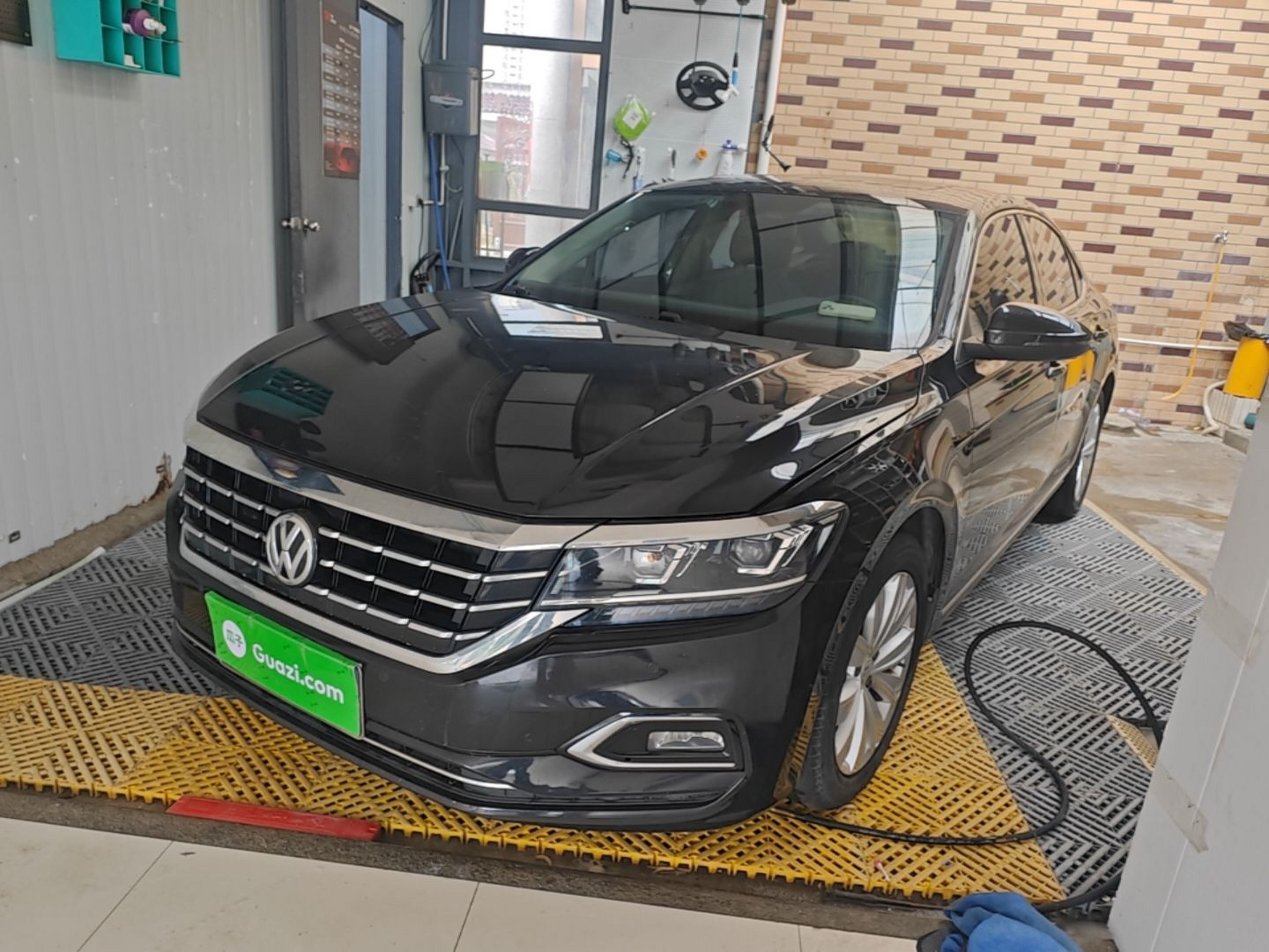 Under the front of the car