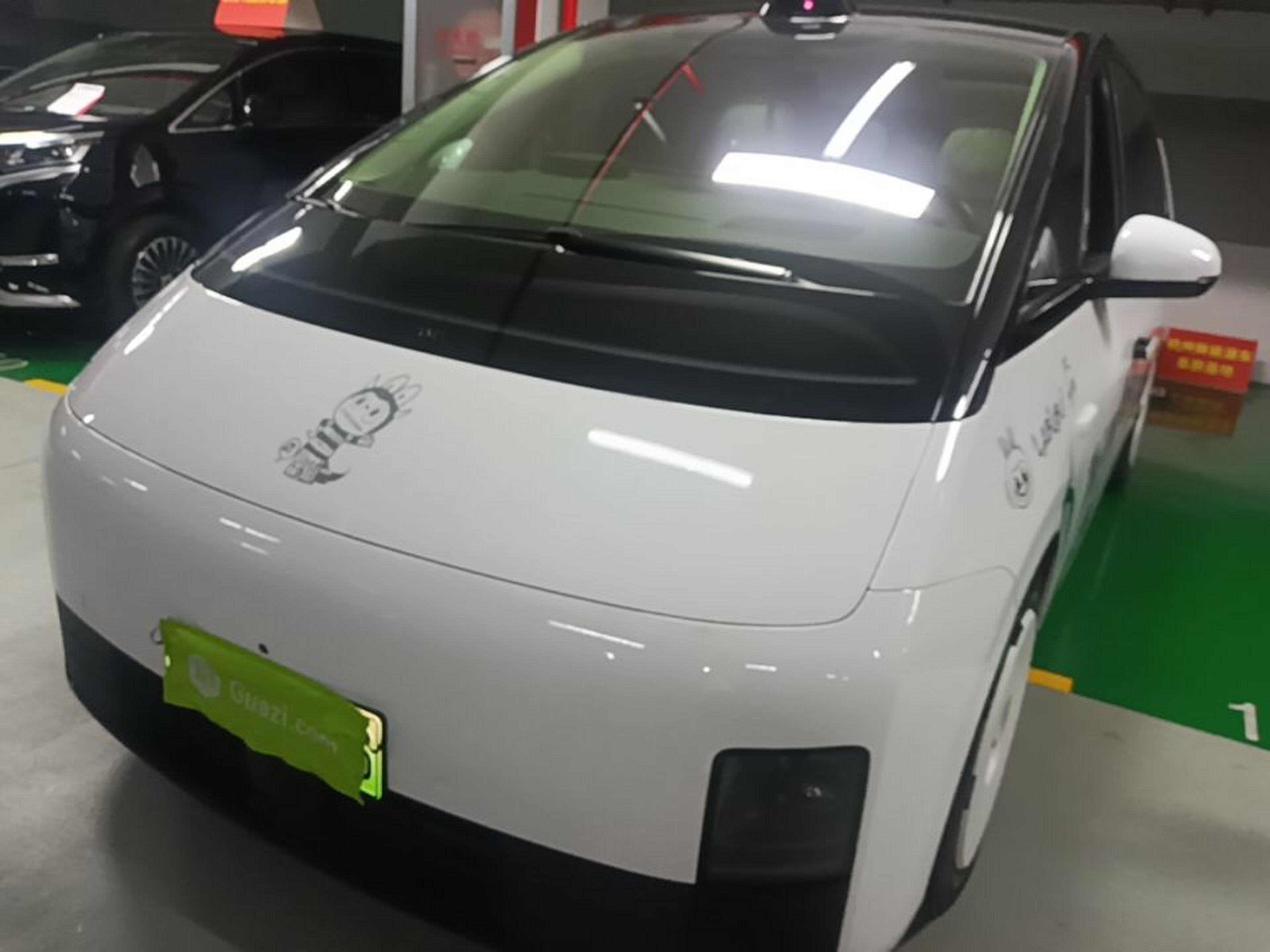 Under the front of the car