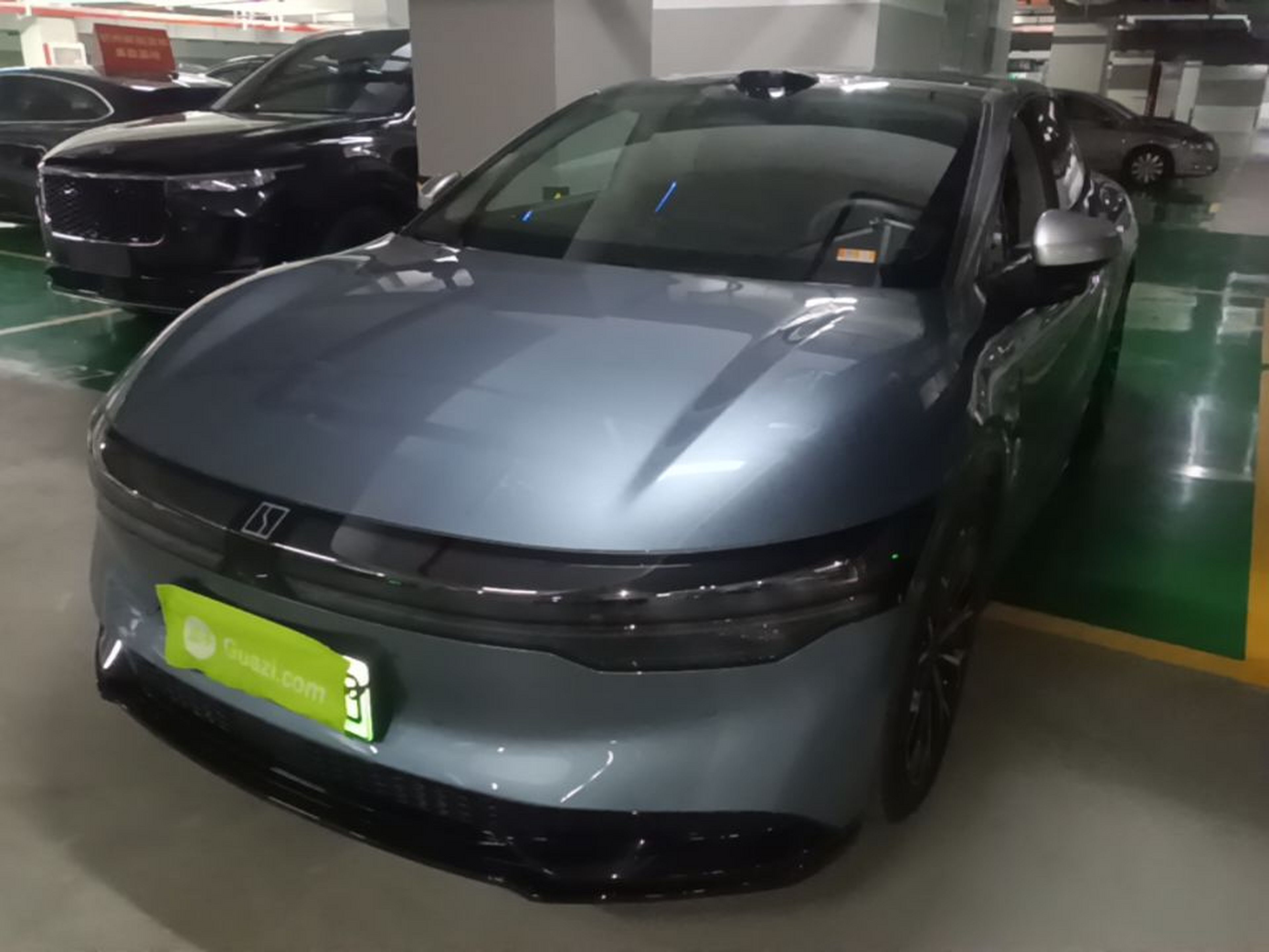 Under the front of the car