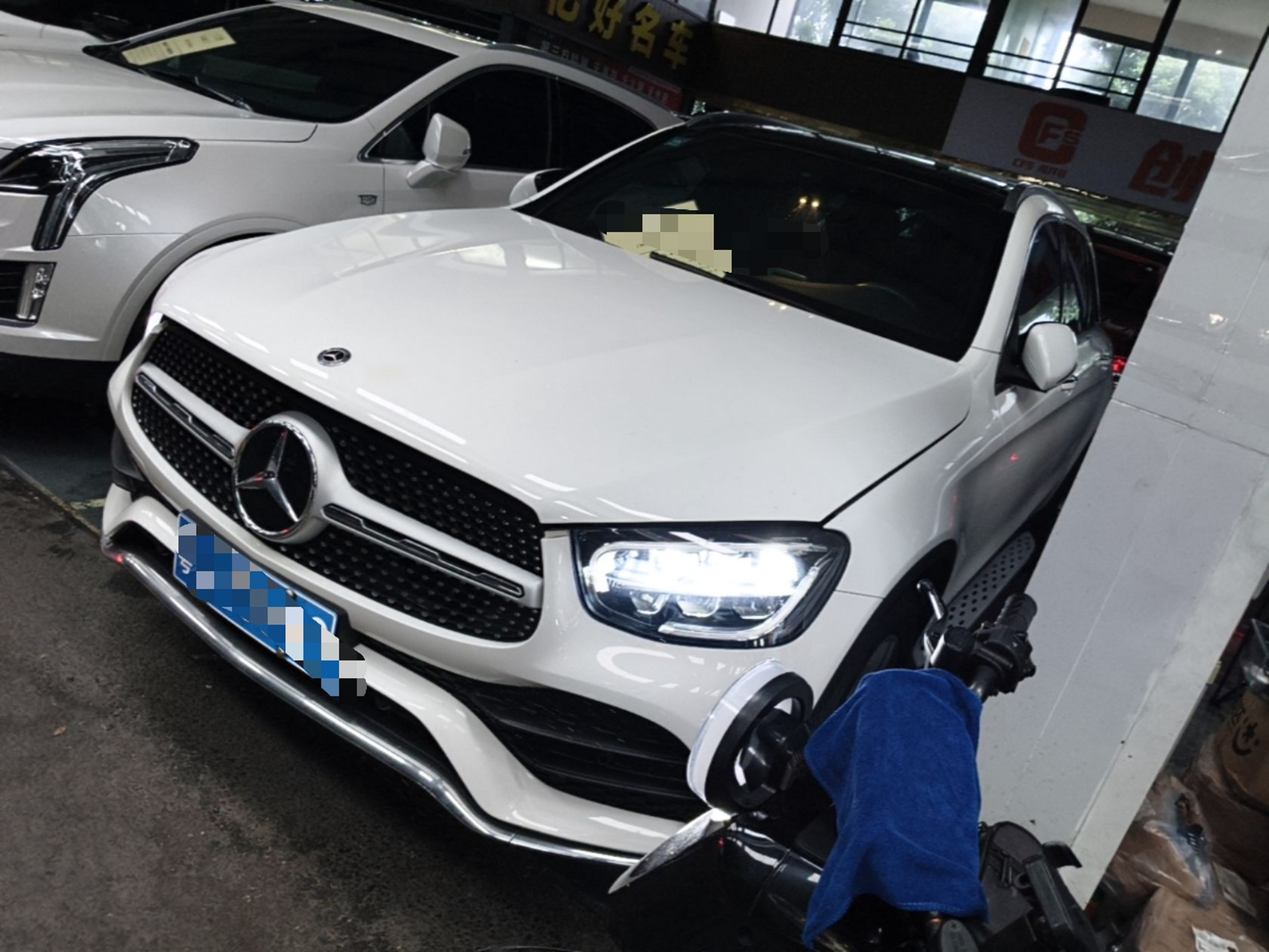 Under the front of the car