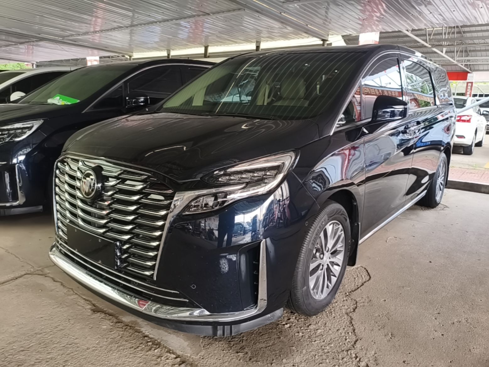Under the front of the car